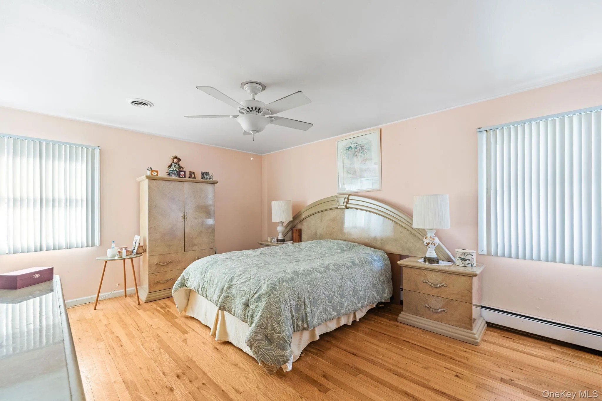 12x16 Primary bedroom with hardwood floors, walk in closet 12x16 Primary bedroom with hardwood floors, walk in closet