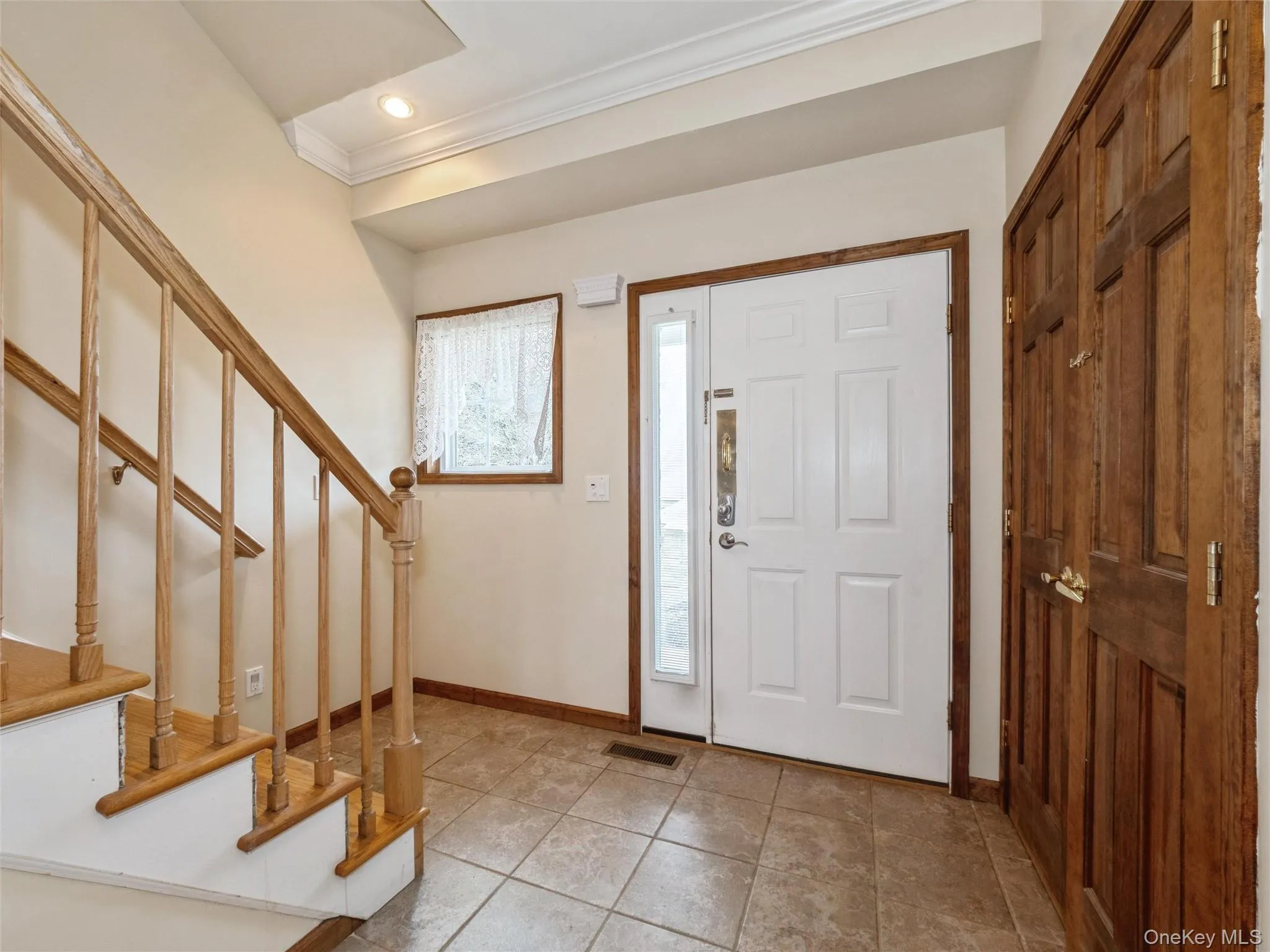Front entrance, tiled floor, double closet Front entrance, tiled floor, double closet