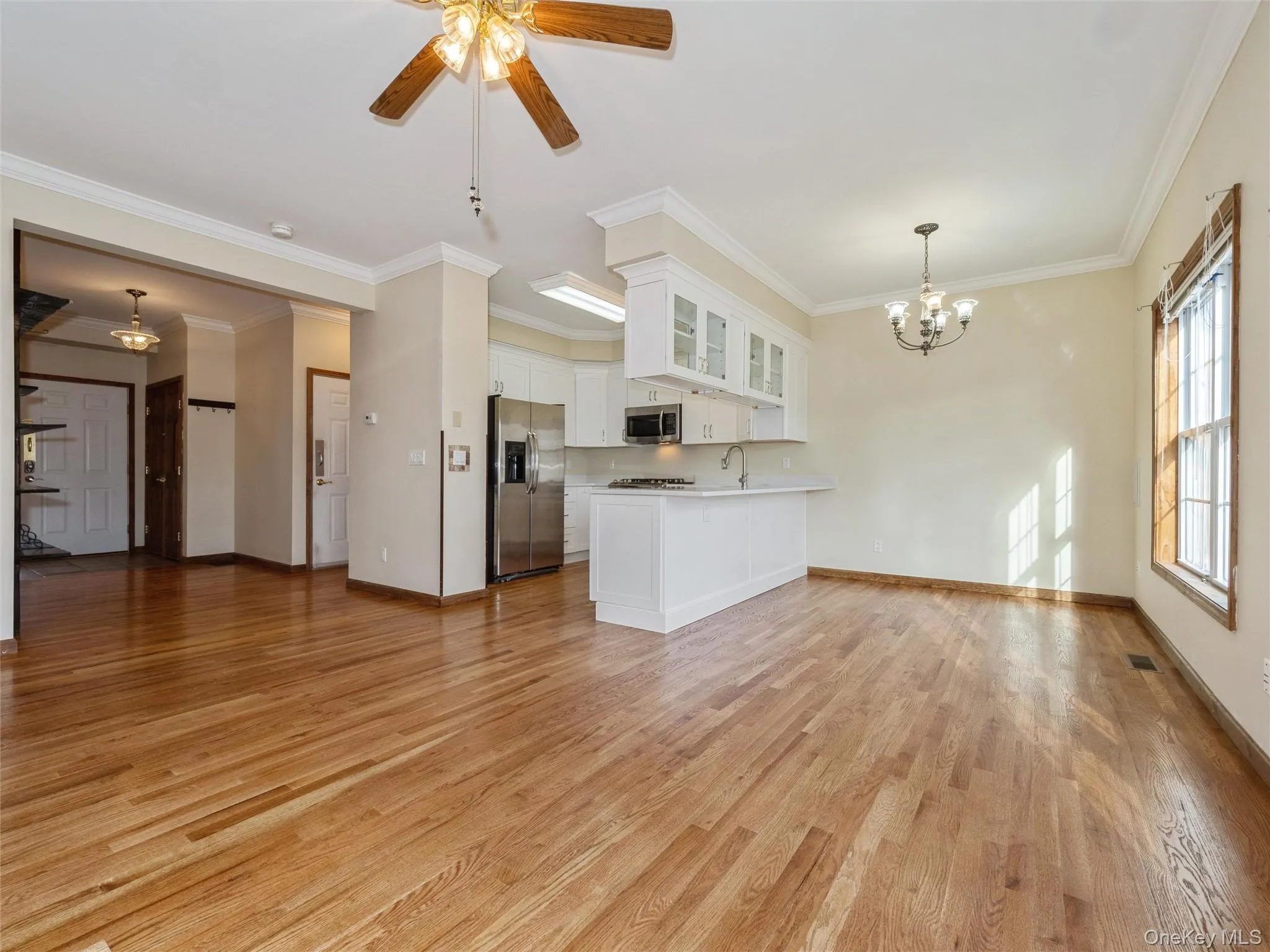 Living area, hardwood floors, ceiling fan Living area, hardwood floors, ceiling fan