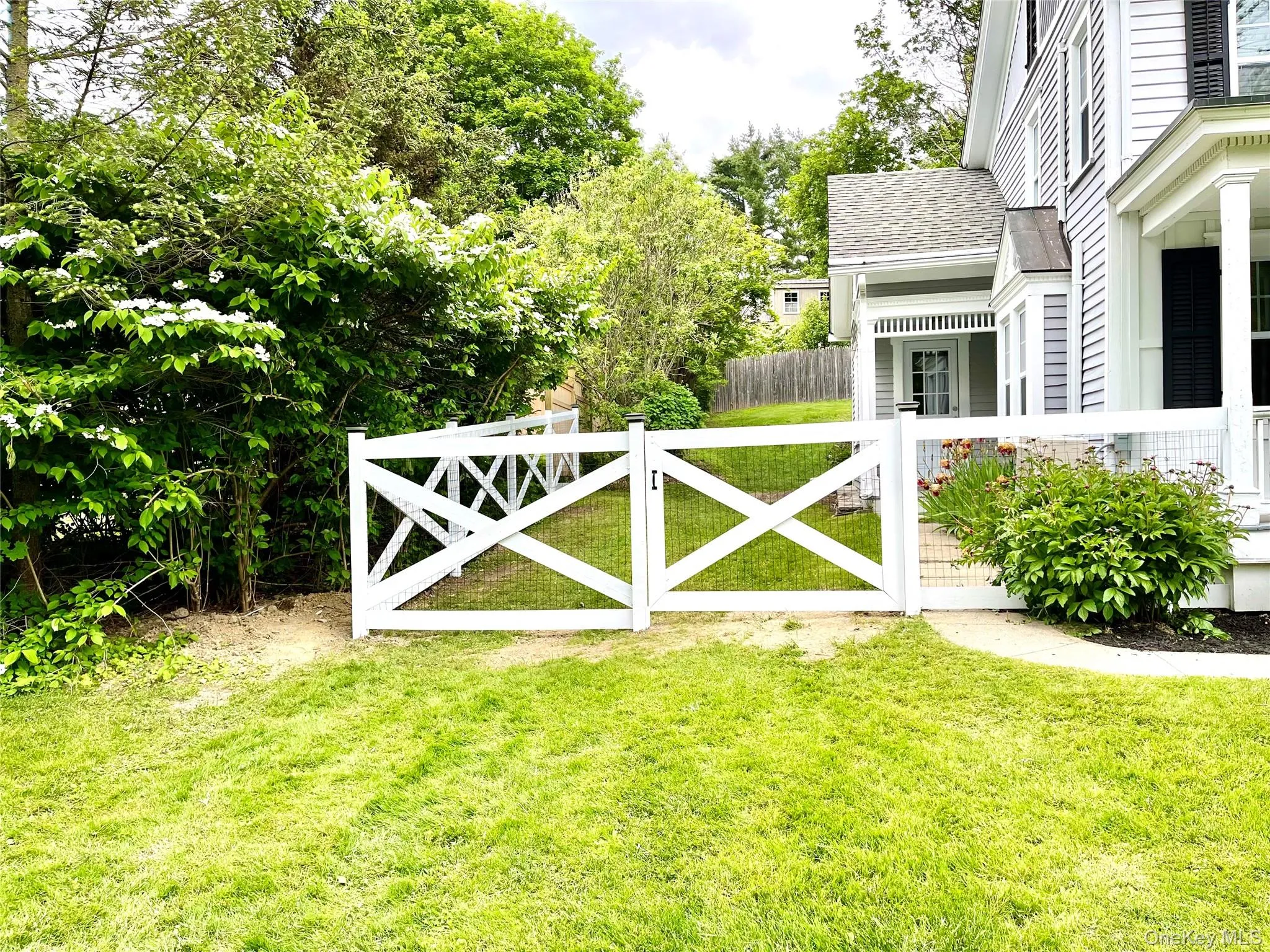 View of gate featuring a yard View of gate featuring a yard