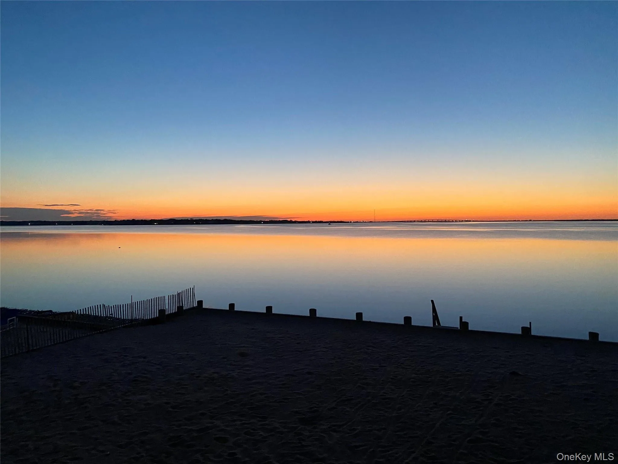View of water feature with fence View of water feature with fence