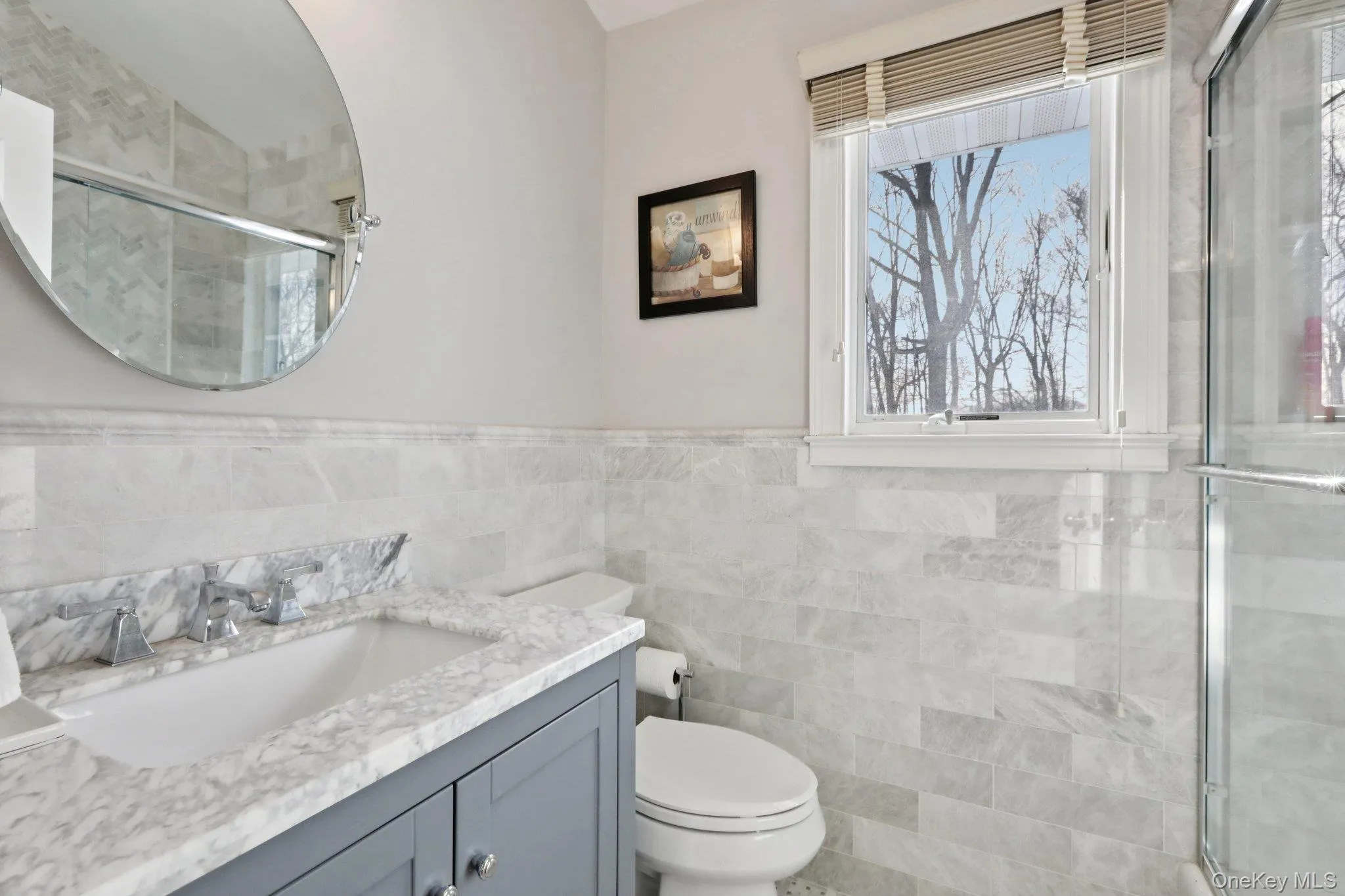 Full Bathroom on 2nd Level. Heated floorsWaterfall Shower, Marble Tile and Vanity Full Bathroom on 2nd Level. Heated floorsWaterfall Shower, Marble Tile and Vanity
