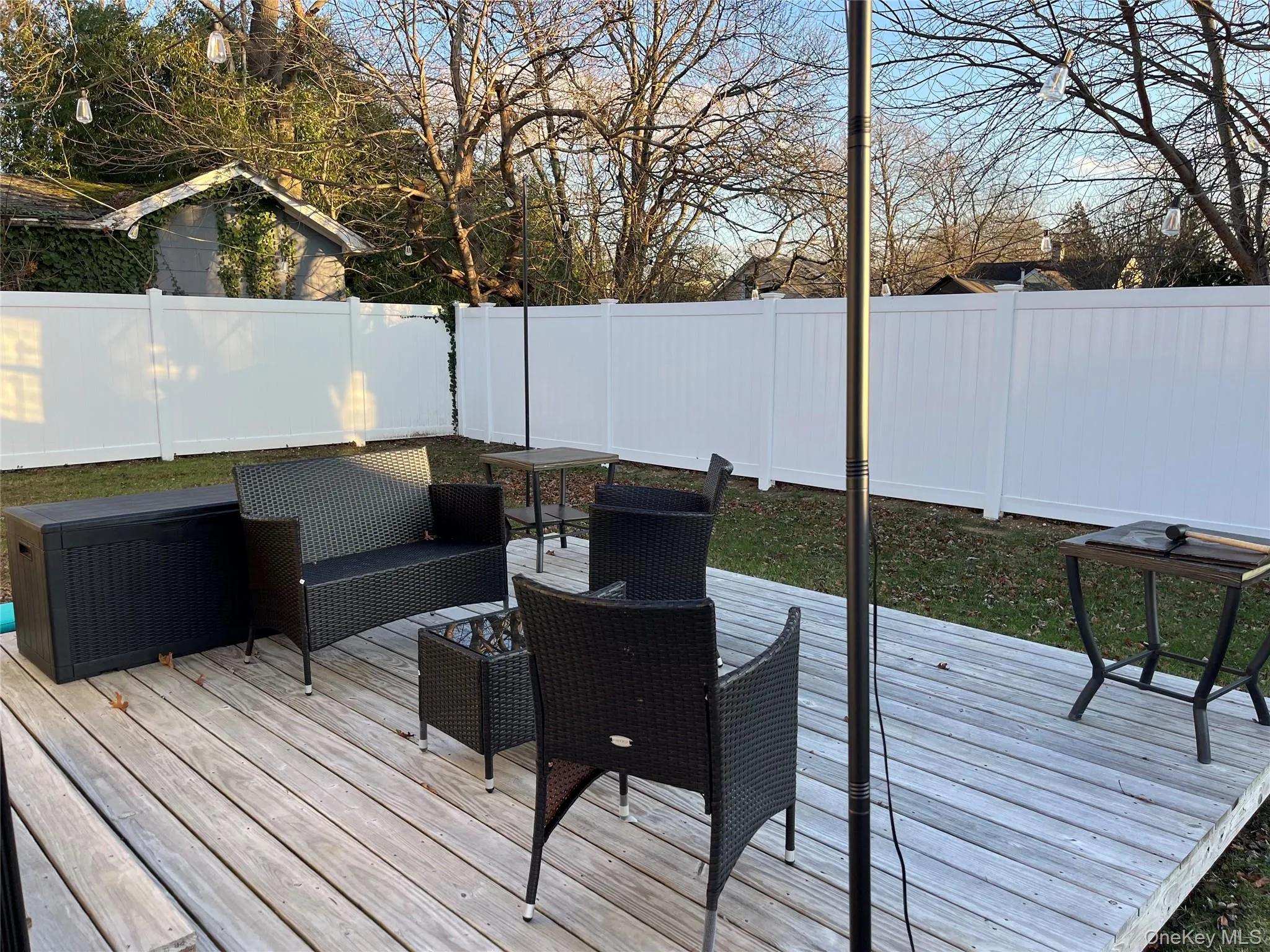 Rear Deck with a fenced backyard and outdoor lounge area Rear Deck with a fenced backyard and outdoor lounge area