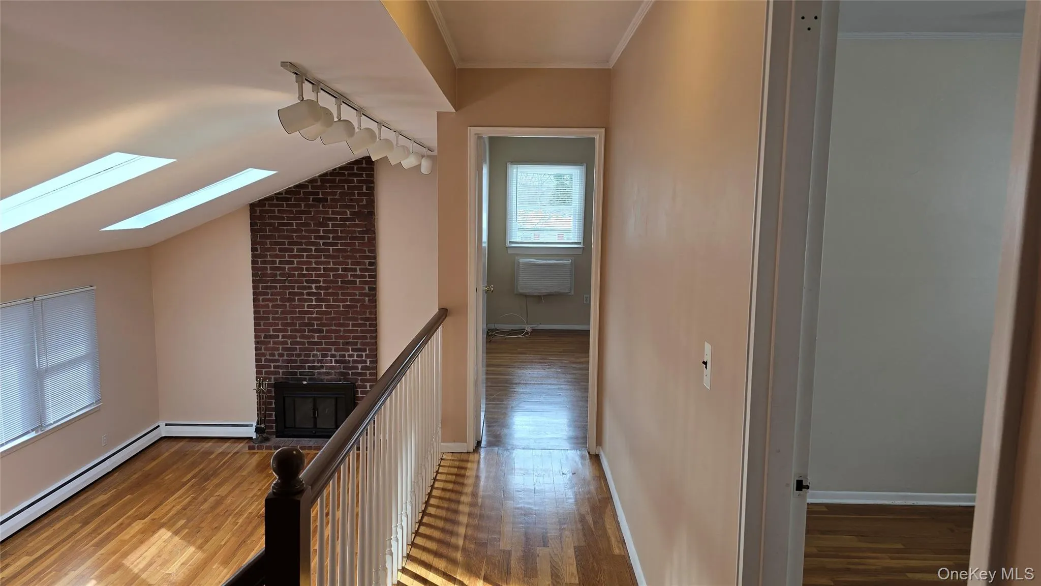 Upstairs hallway with overlook to Living room Upstairs hallway with overlook to Living room