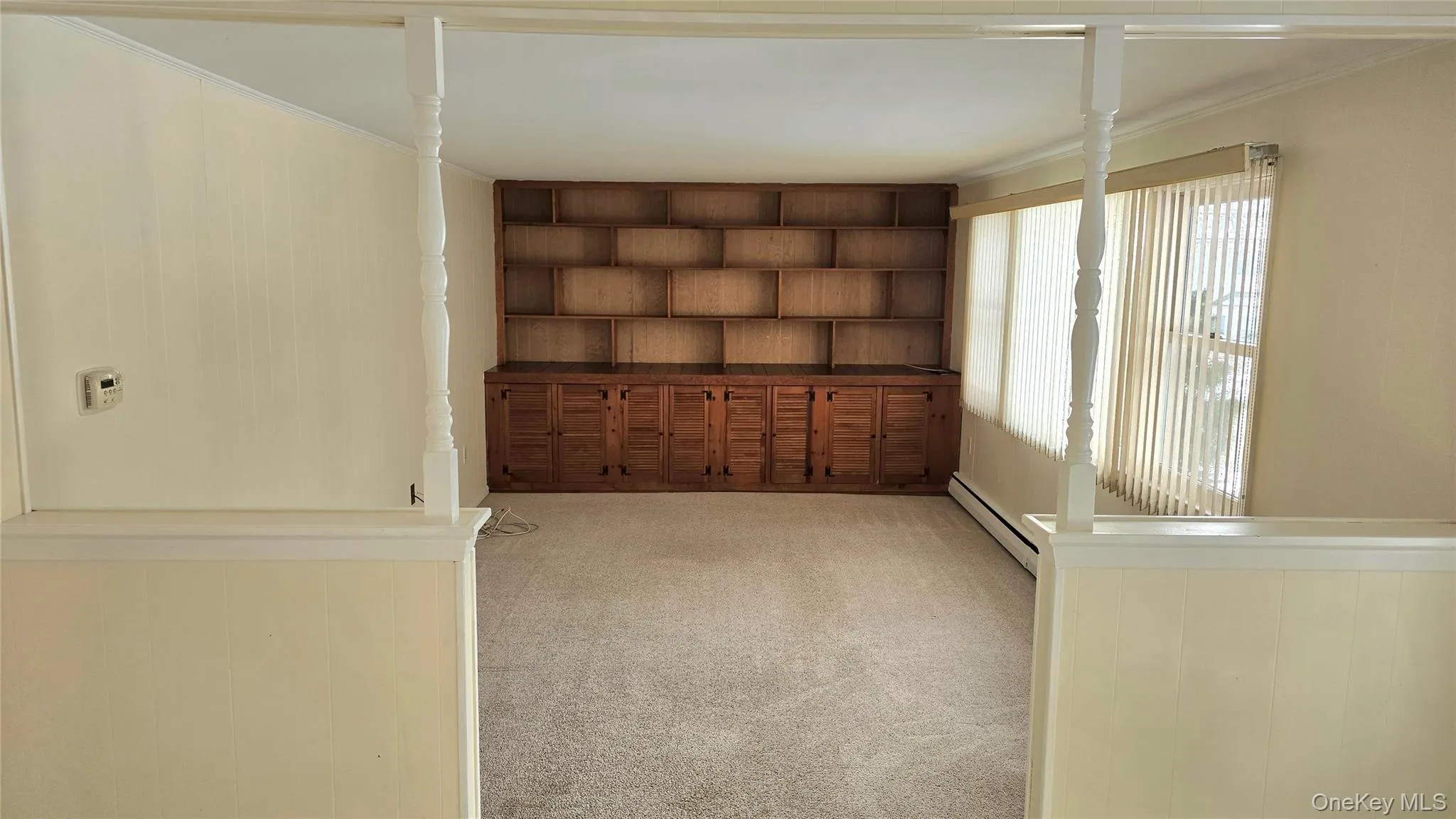 Den with storage and built in bookcase Den with storage and built in bookcase