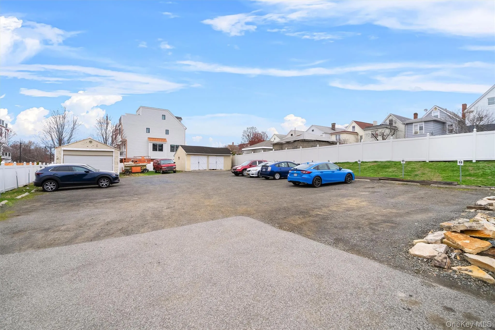 Uncovered parking lot with a residential view Uncovered parking lot with a residential view