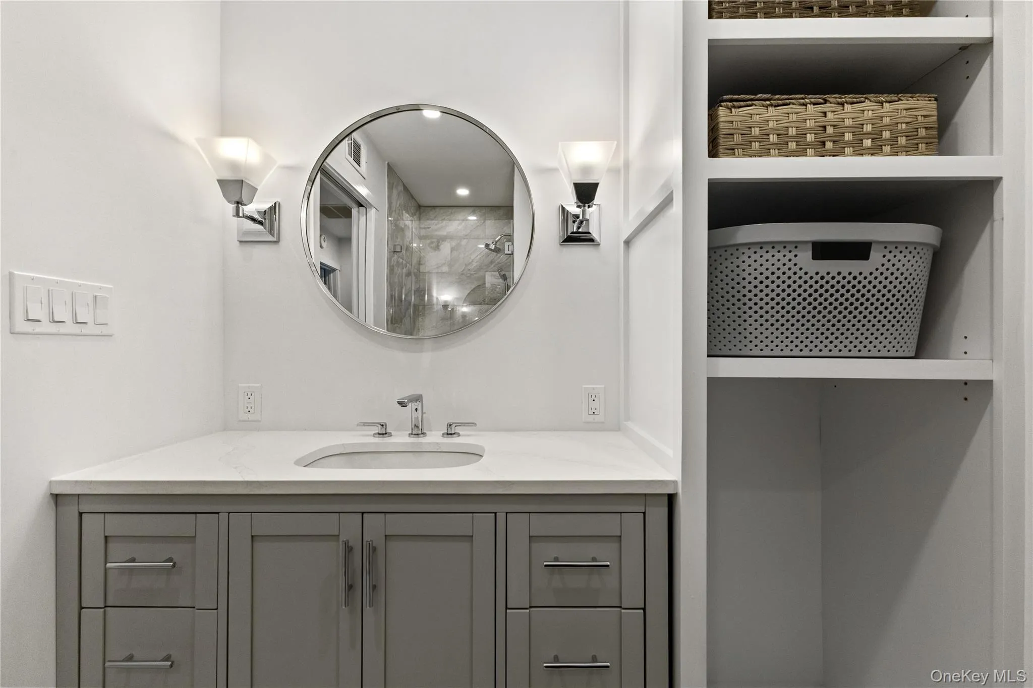 Hall bath with vanity, sink and shelving. Hall bath with vanity, sink and shelving.