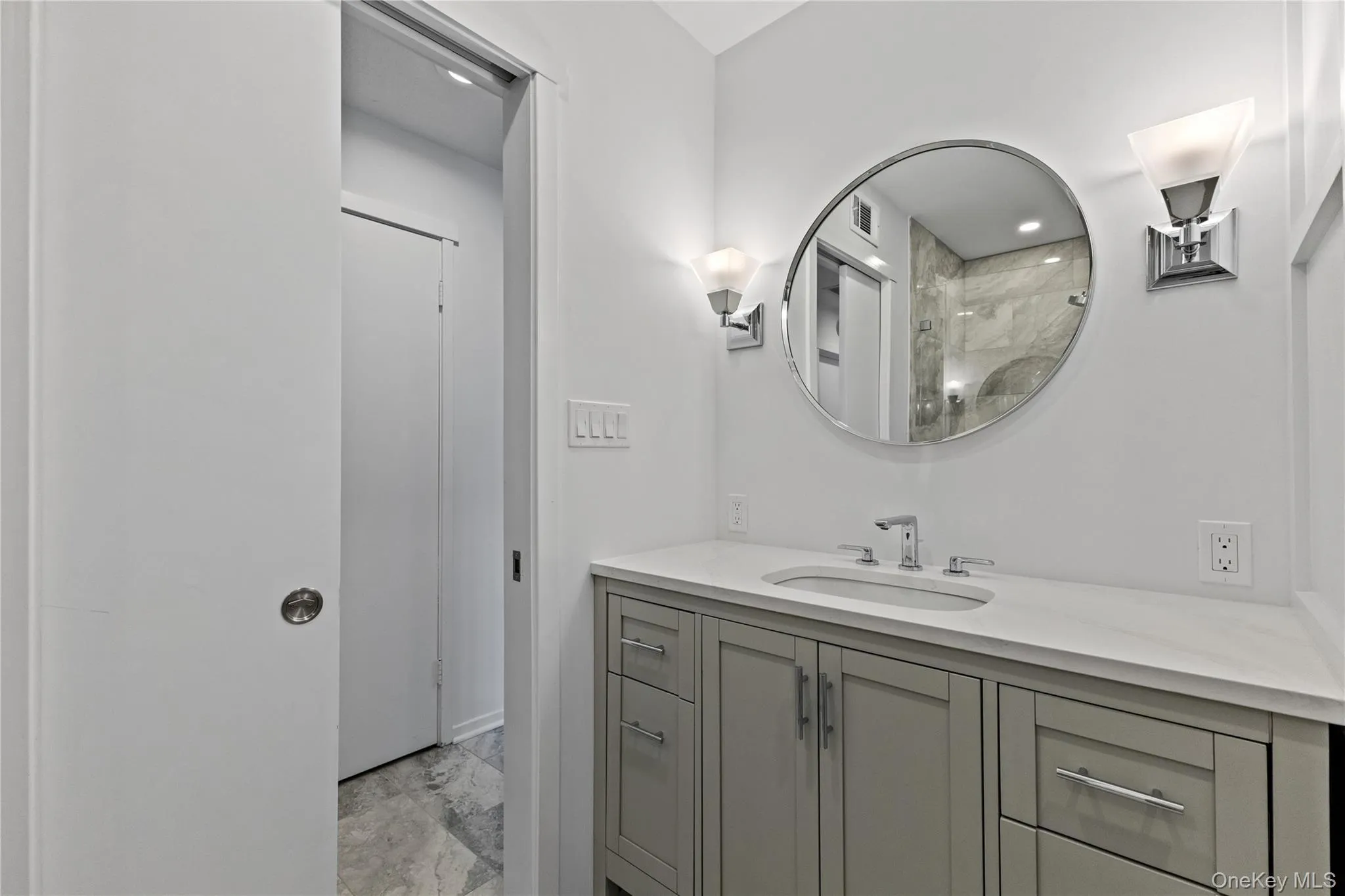 Hall bath with pocket door. Hall bath with pocket door.
