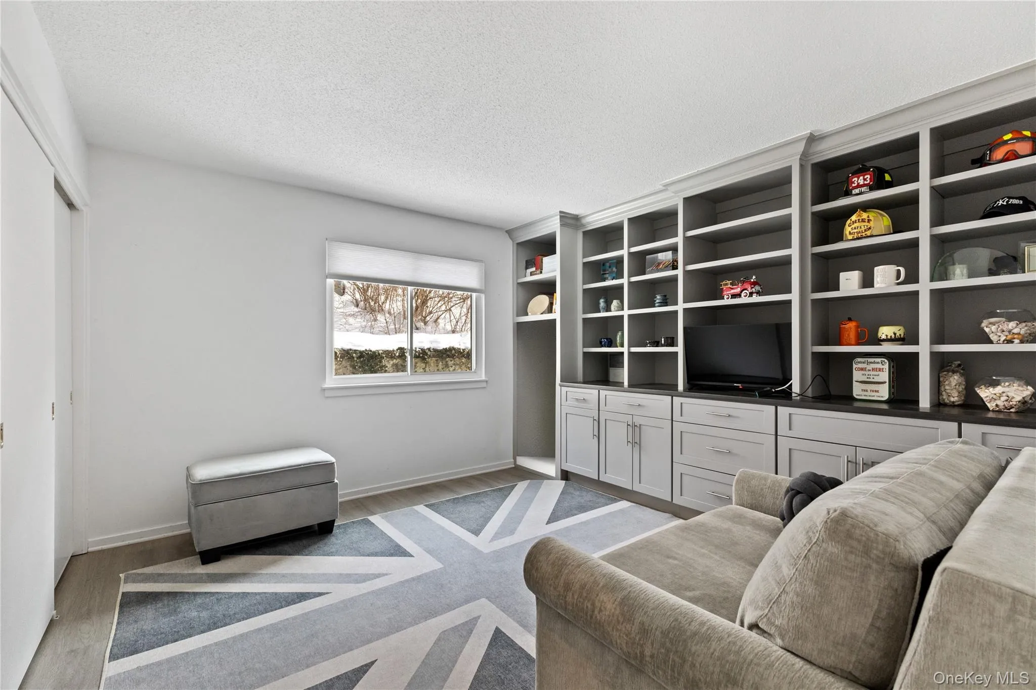 Second bedroom with a fabulous custom wall built-in. Brazilian wood- laminate floor. Second bedroom with a fabulous custom wall built-in. Brazilian wood- laminate floor.