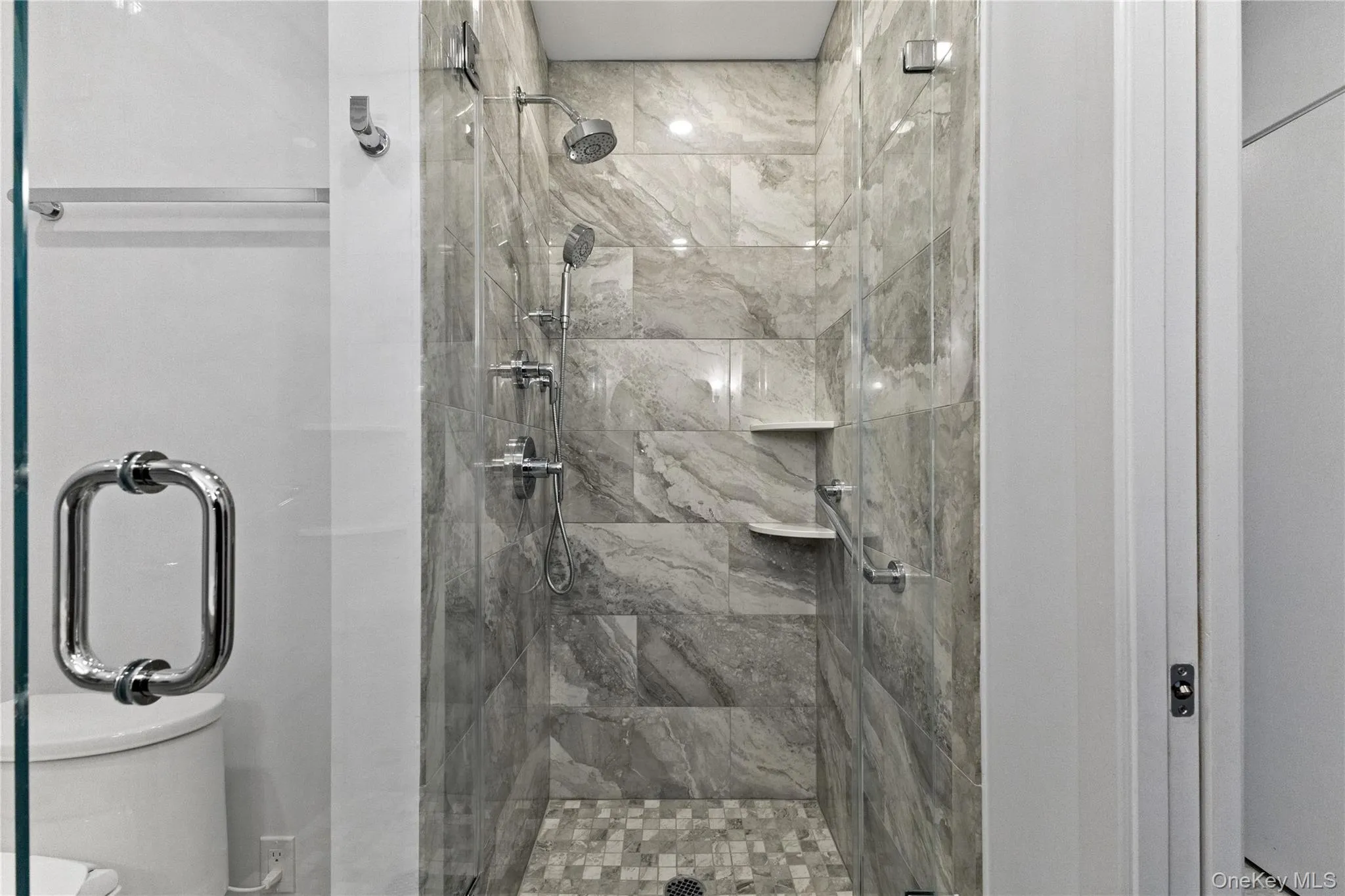 Hall bath with porcelain tiled shower surround. Hall bath with porcelain tiled shower surround.