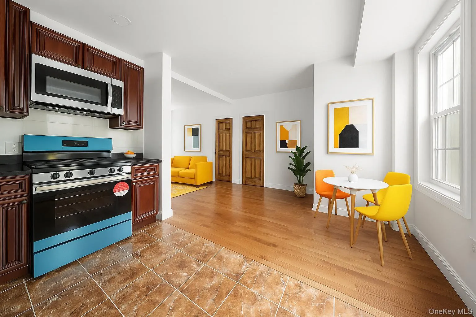 Kitchen with stainless steel appliances, dark countertops, and plenty of natural light Kitchen with stainless steel appliances, dark countertops, and plenty of natural light