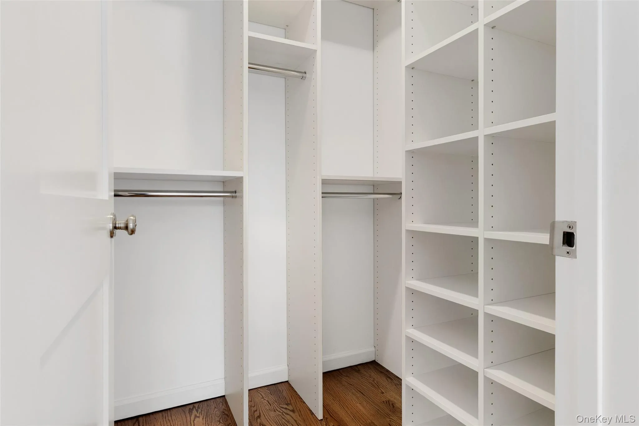Walk in closet with wood finished floors Walk in closet with wood finished floors