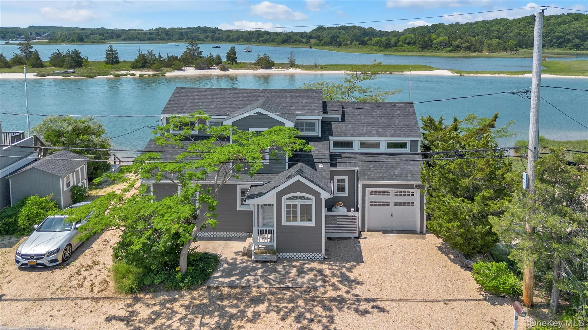 View of subject property featuring a large body of water View of subject property featuring a large body of water