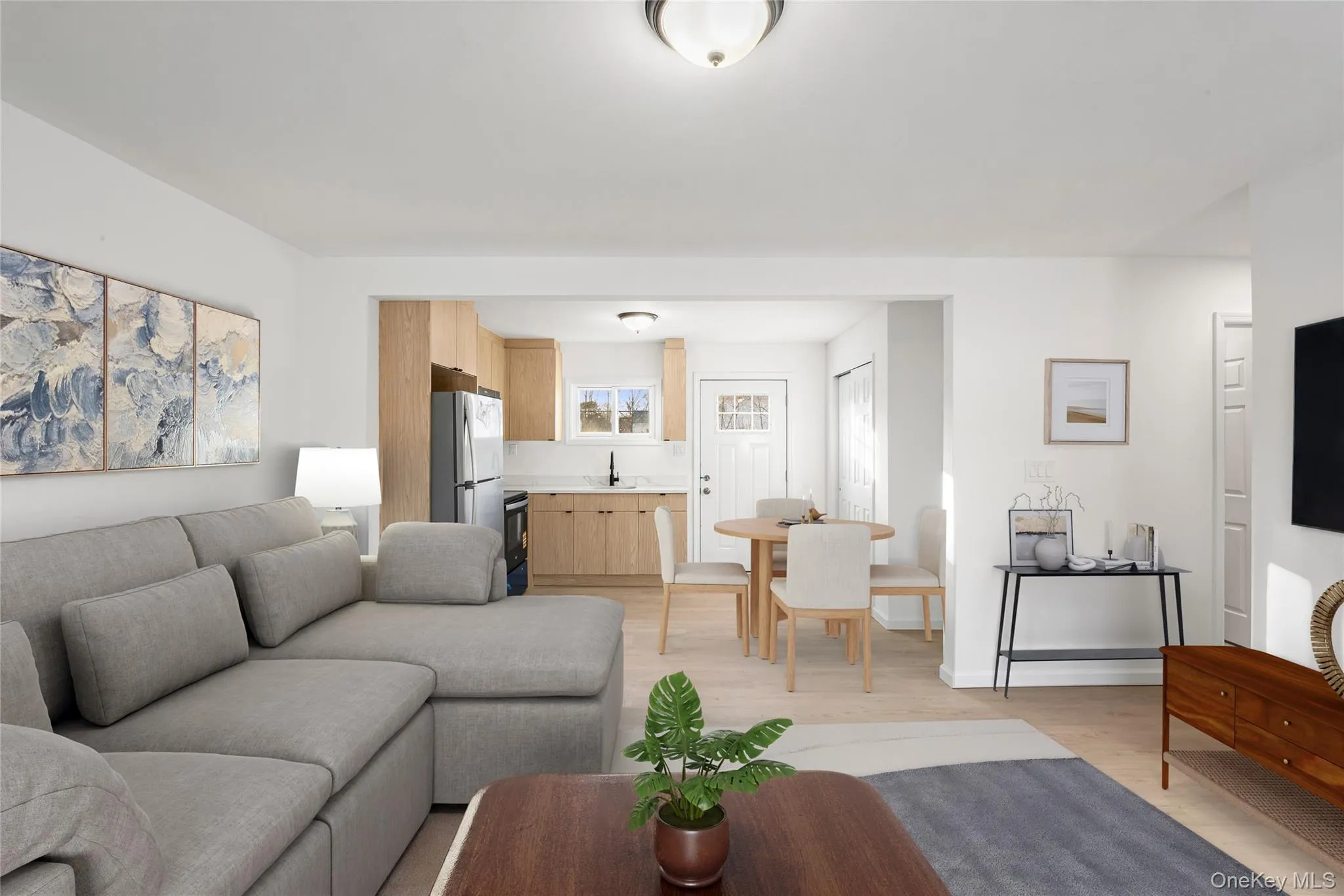 Digitally staged to show space in large living room Digitally staged to show space in large living room
