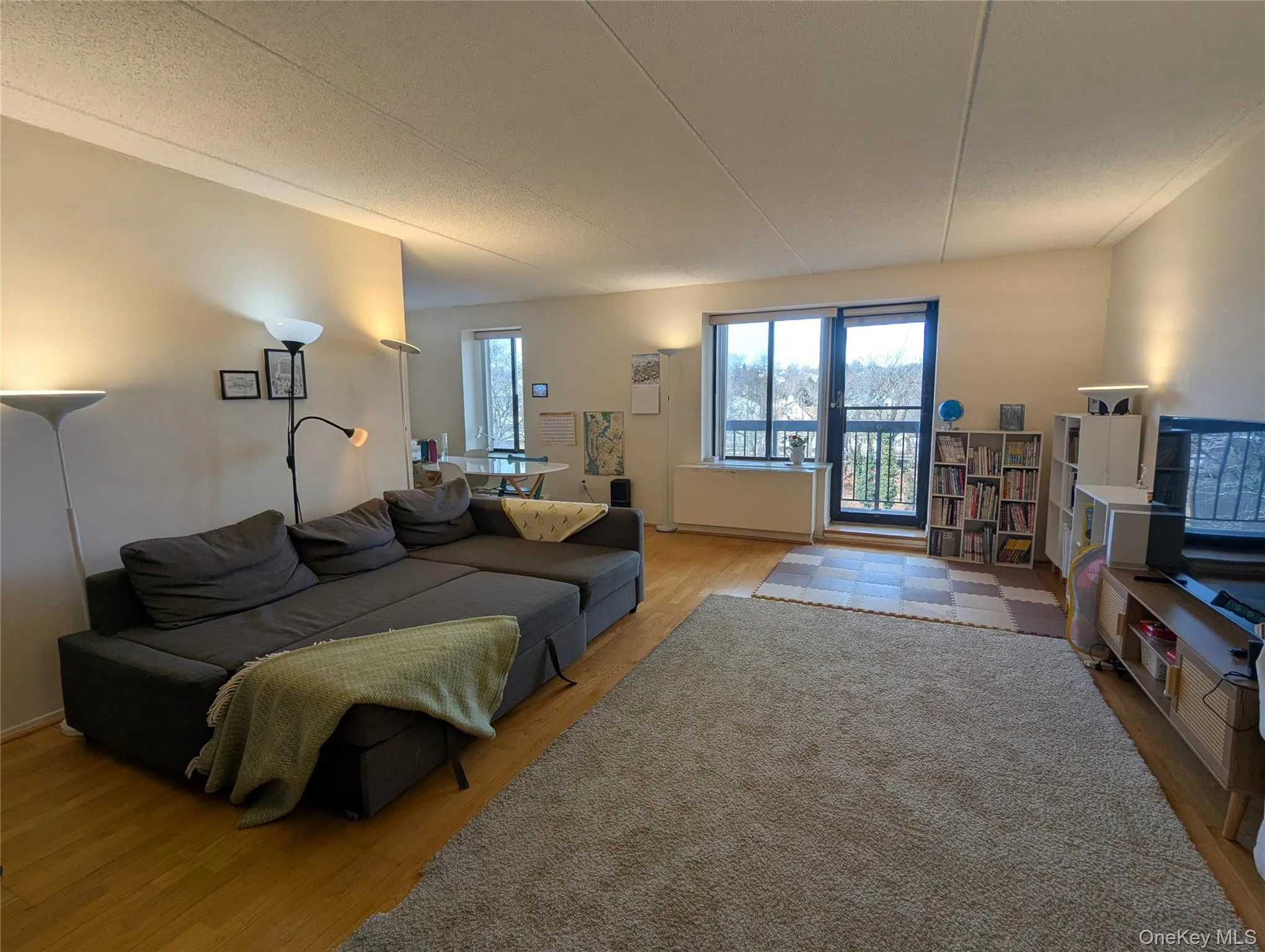 Sundrenched living room app 21 x 14 with doors to a private balcony Sundrenched living room app 21 x 14 with doors to a private balcony