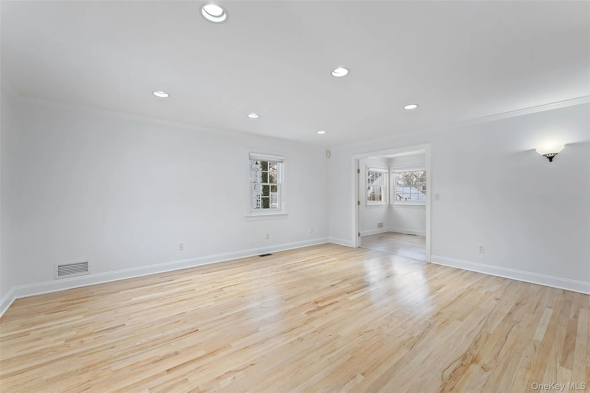 Living room with French doors that can open fully or remain closed for privacy Living room with French doors that can open fully or remain closed for privacy