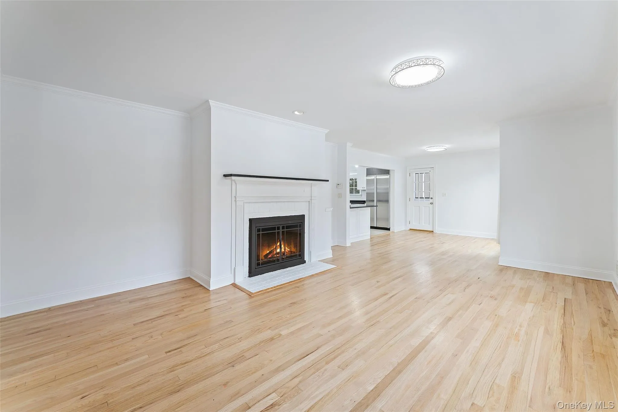 Den with wood burning fireplace. Den with wood burning fireplace.