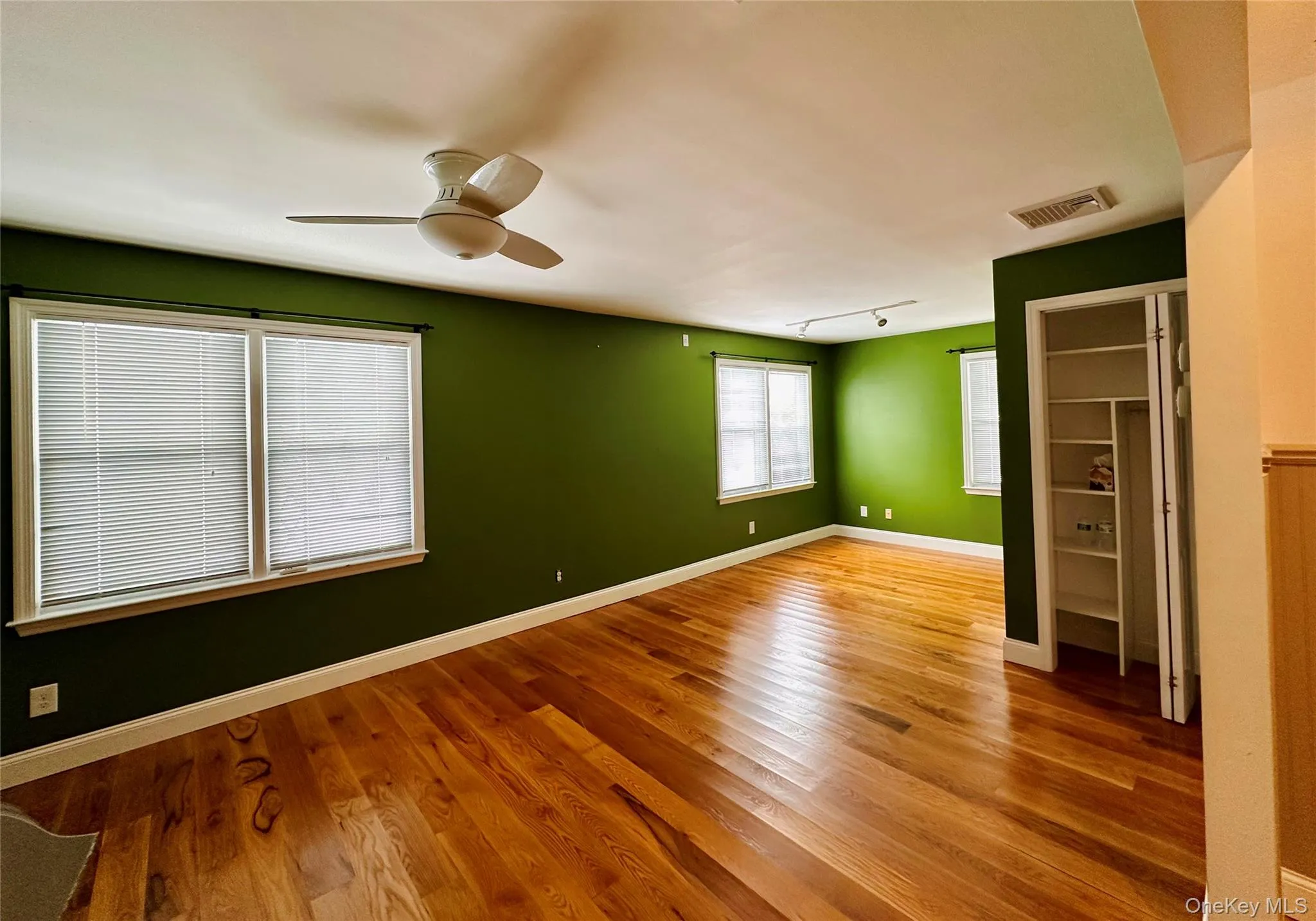 Living room with hardwood floors and lots of windows Living room with hardwood floors and lots of windows