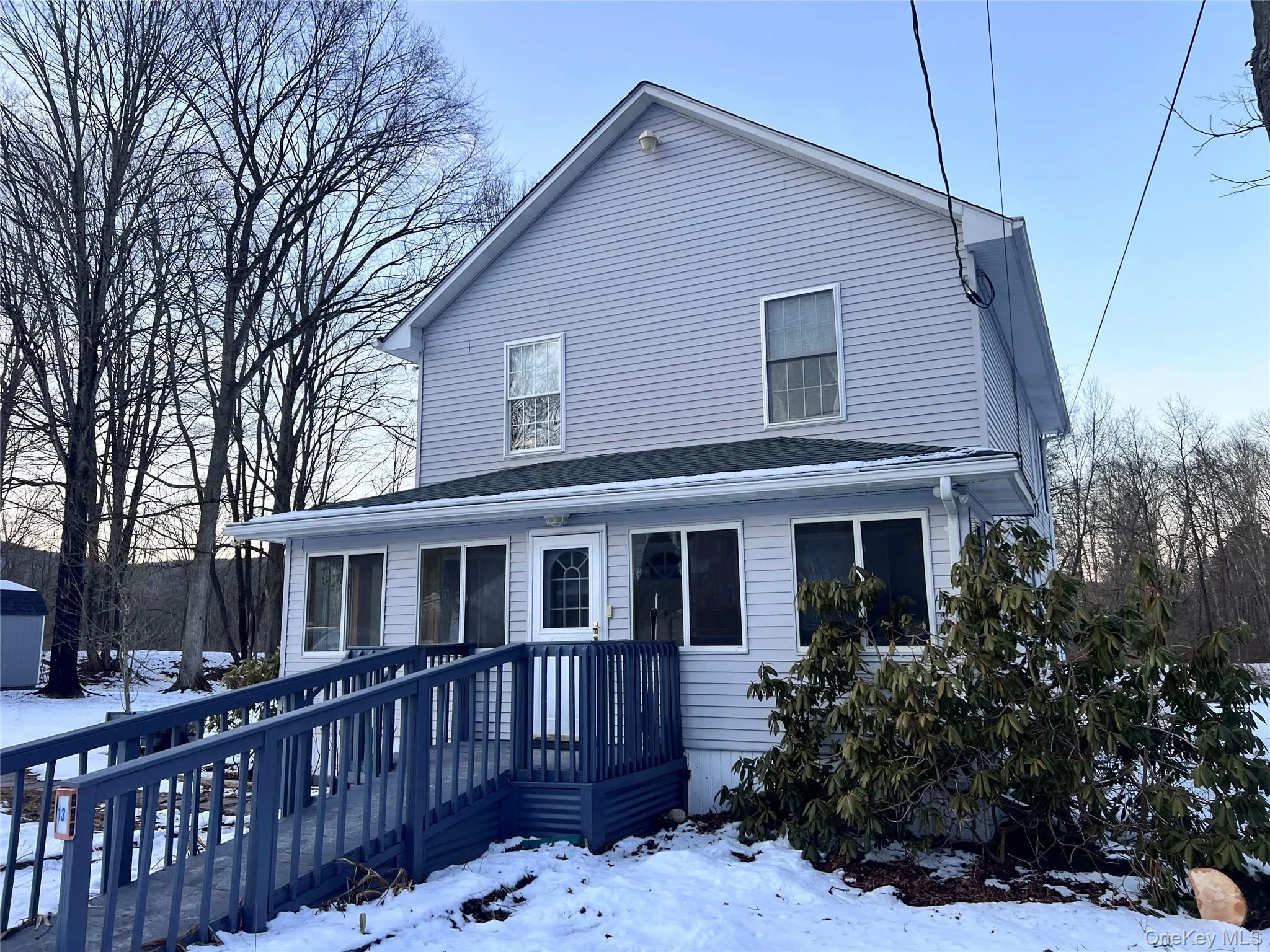 Home with access ramp and enclosed porch. Home with access ramp and enclosed porch.