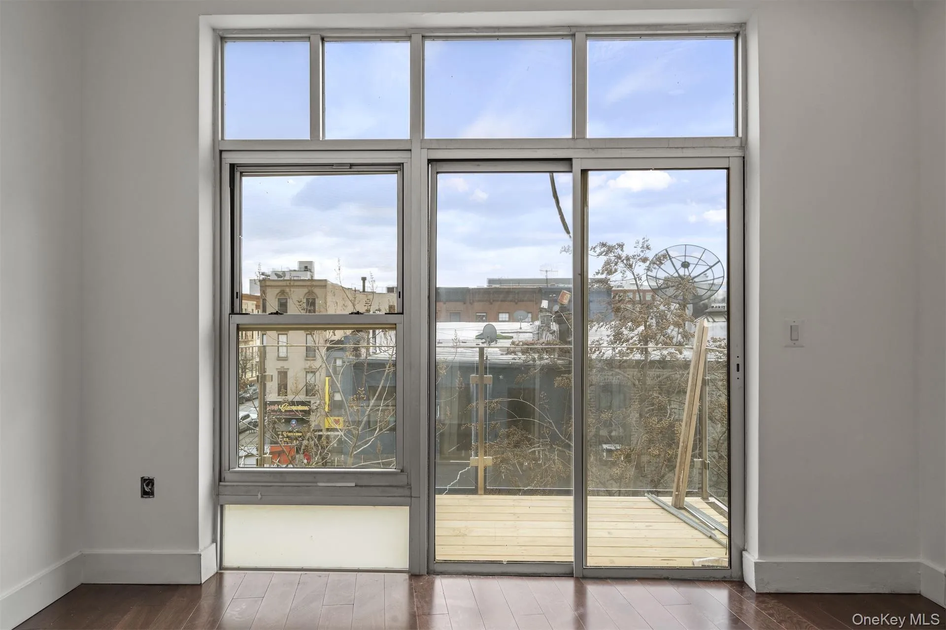 Doorway featuring plenty of natural light and wood finished floors Doorway featuring plenty of natural light and wood finished floors