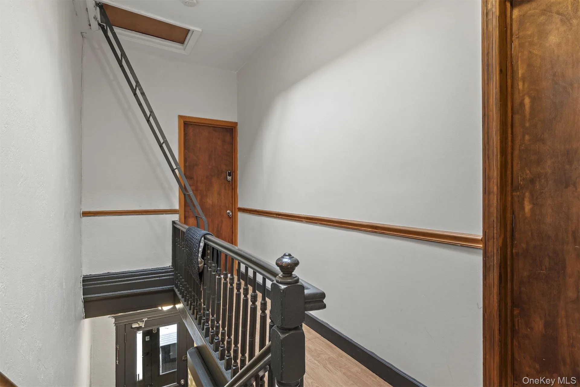 Staircase with wood finished floors and baseboards Staircase with wood finished floors and baseboards