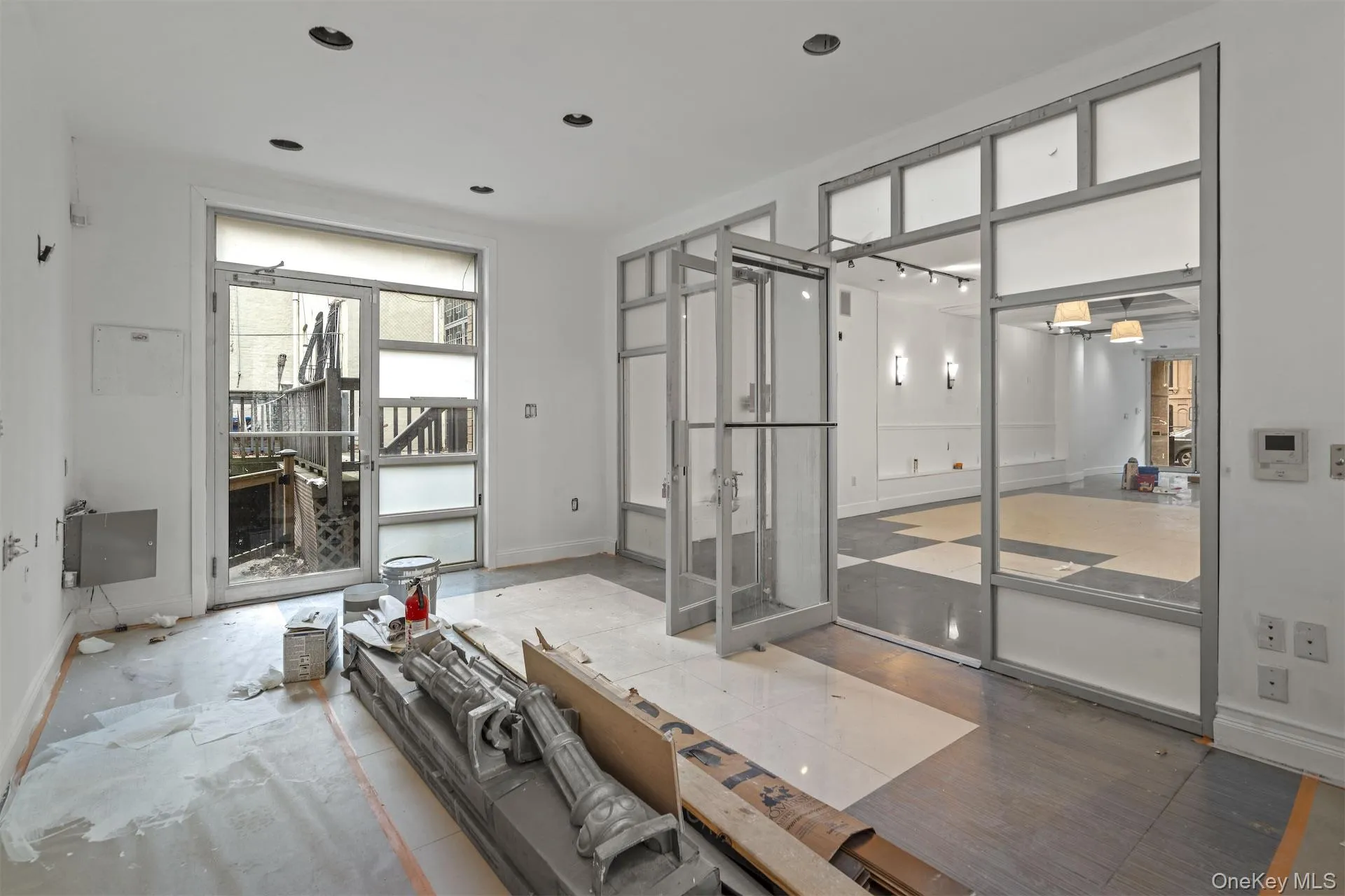 Unfurnished living room featuring baseboards Unfurnished living room featuring baseboards