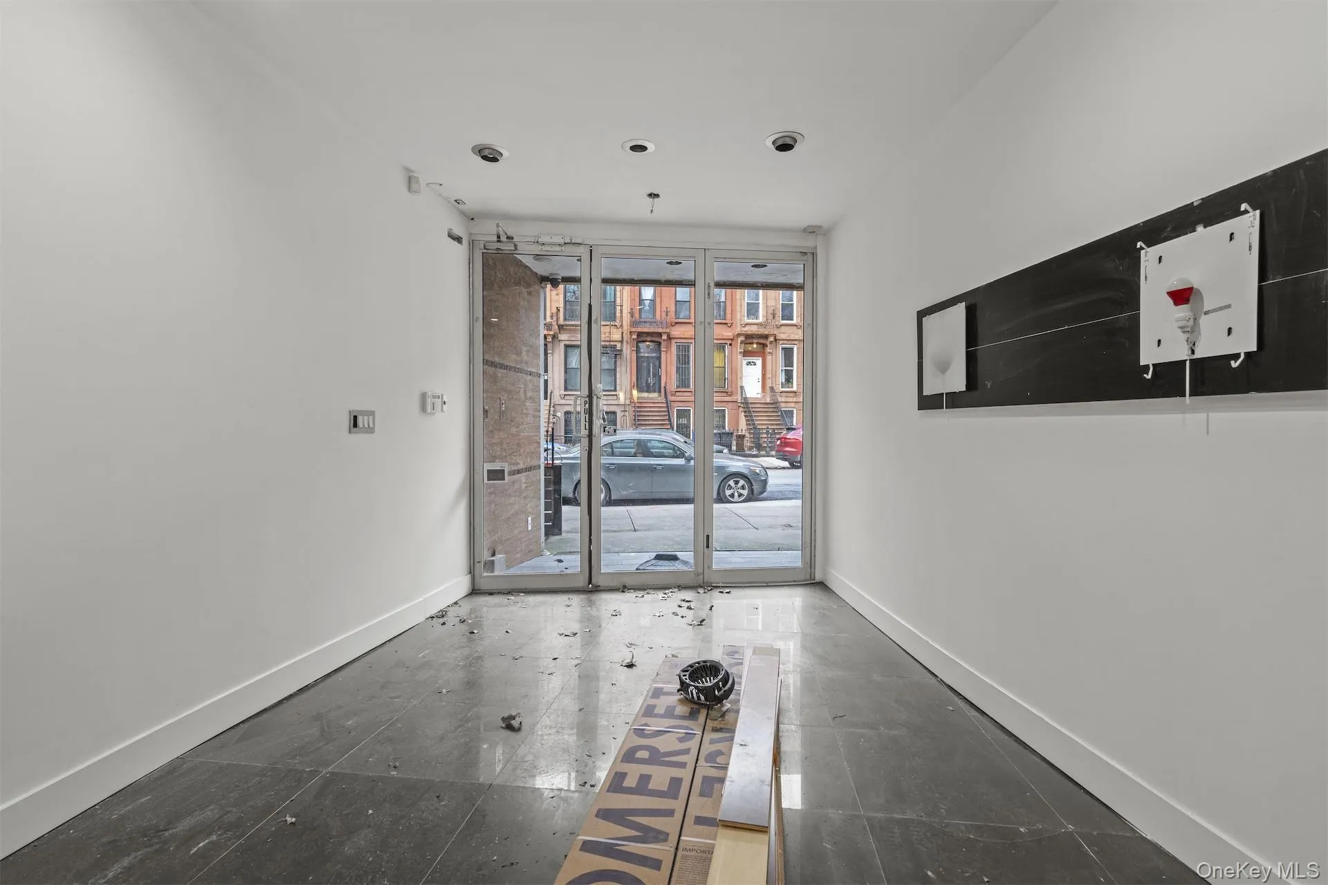 Hallway with a wall of windows and baseboards Hallway with a wall of windows and baseboards