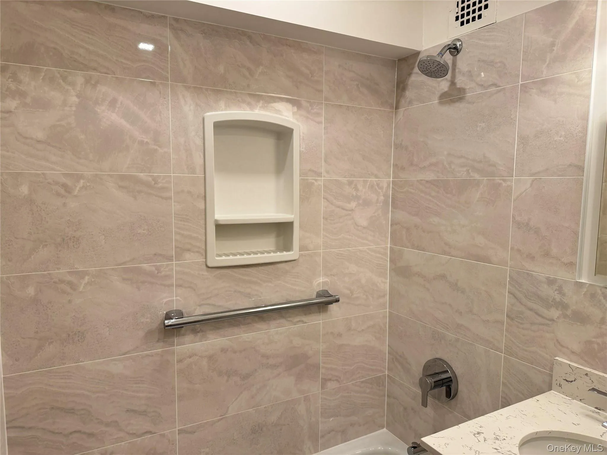 Bathroom with bathing tub / shower combination and vanity Bathroom with bathing tub / shower combination and vanity