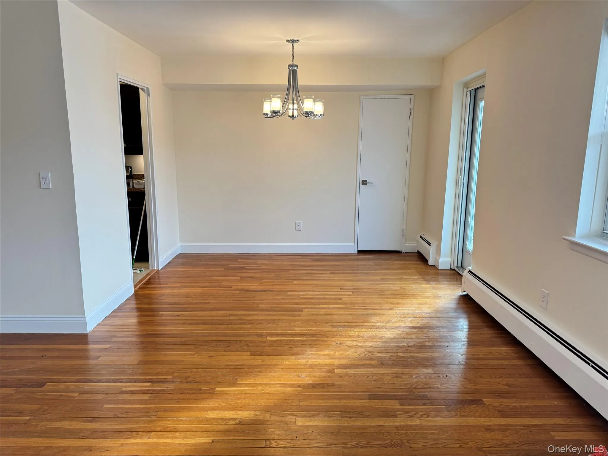 Dining Room with closet, chandelier and exit to terrace over looking the Hudson River Dining Room with closet, chandelier and exit to terrace over looking the Hudson River
