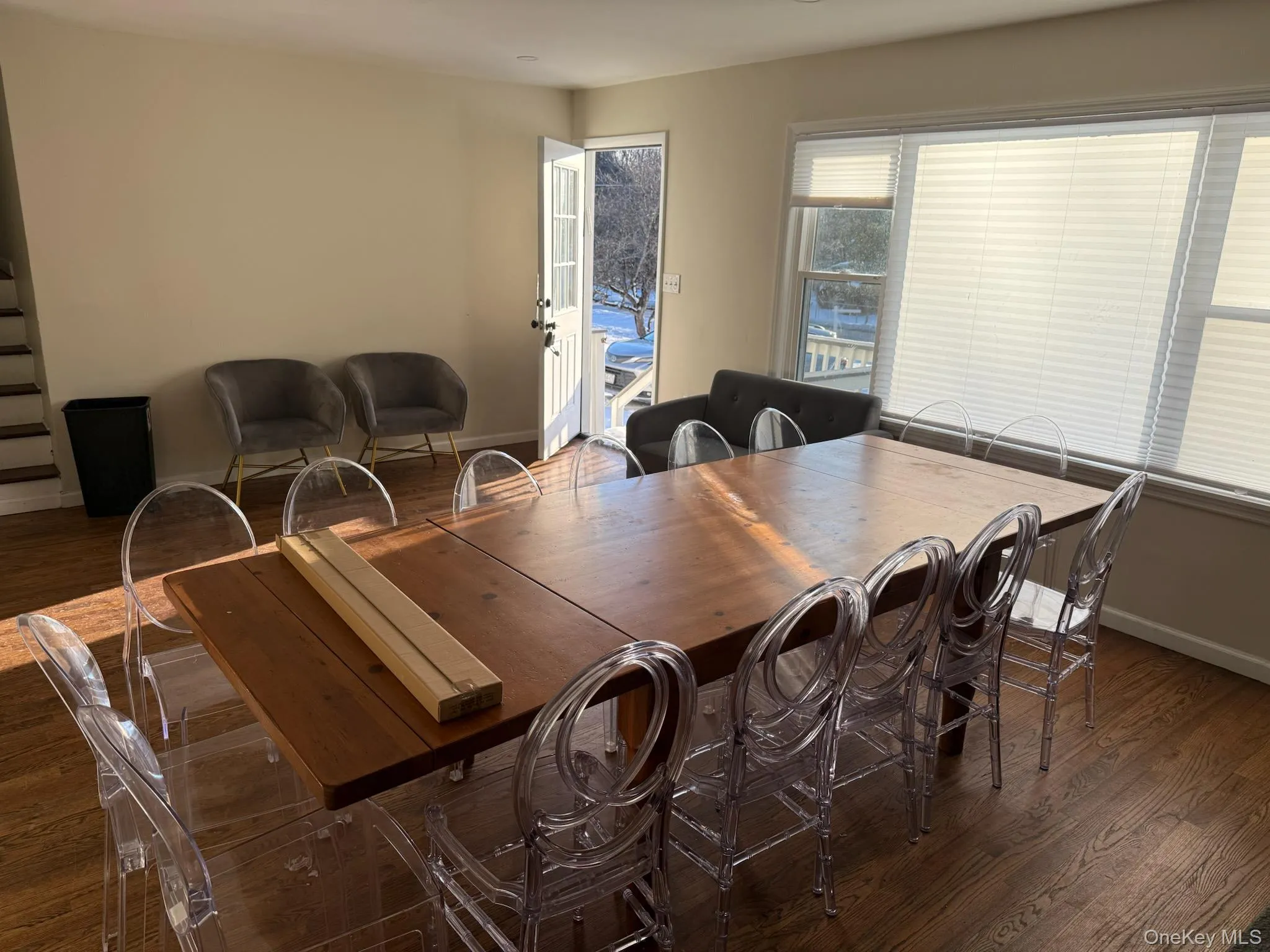 Dining room with dark wood-style floors and baseboards Dining room with dark wood-style floors and baseboards