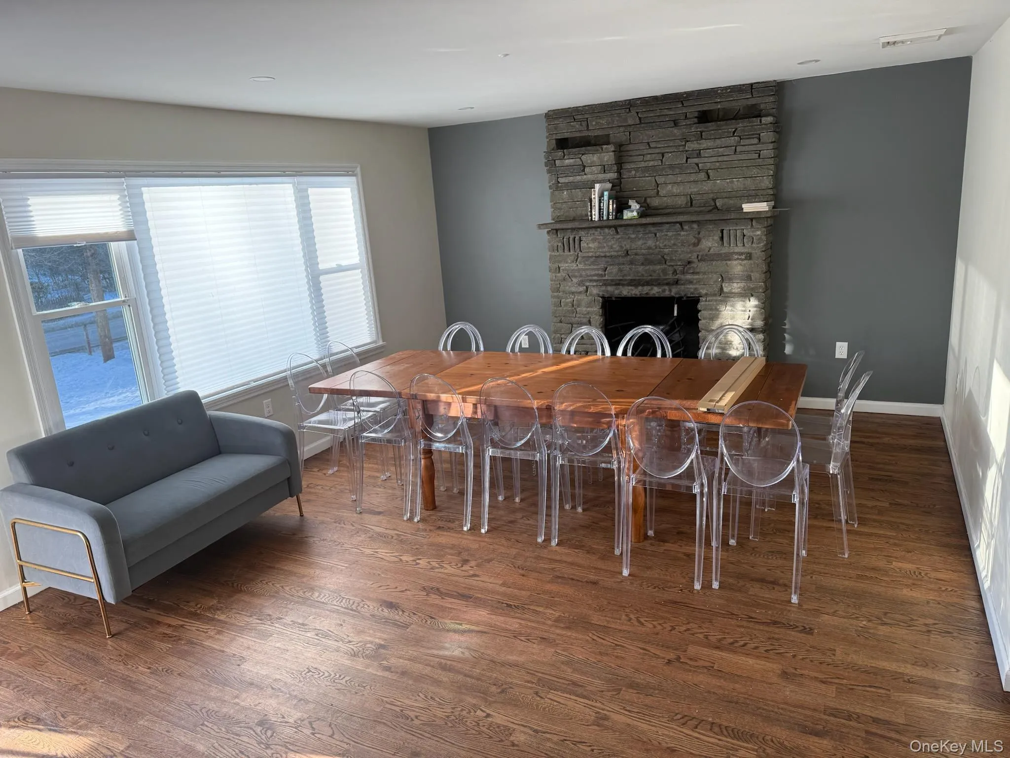 Dining room with a fireplace and dark wood finished floors Dining room with a fireplace and dark wood finished floors
