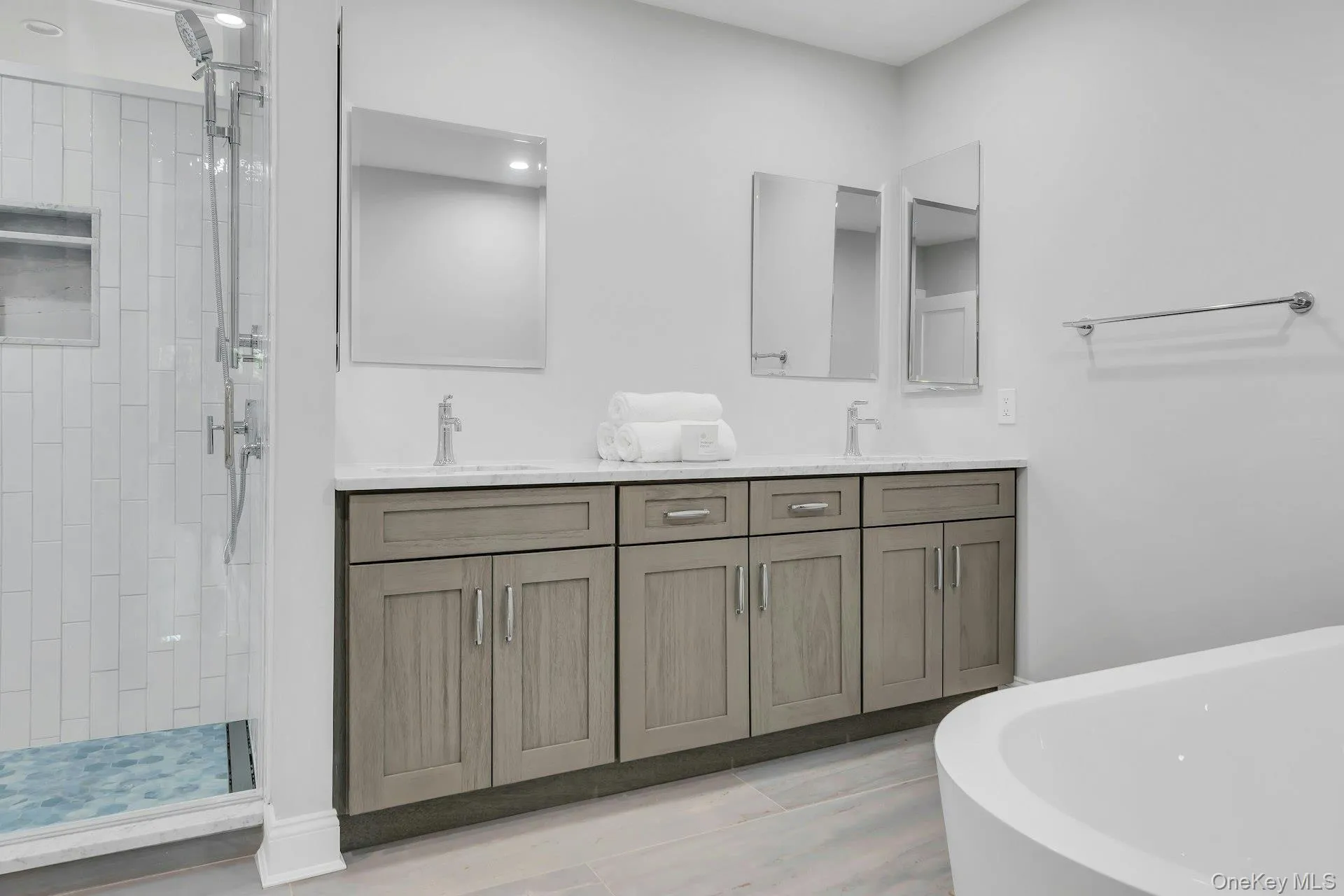 Primary bathroom suite, porcelain heated floors spacious walk-in shower with seating, spacious soaking tub, double vanity, double mirrors and double medicine cabinets. Primary bathroom suite, porcelain heated floors spacious walk-in shower with seating, spacious soaking tub, double vanity, double mirrors and double medicine cabinets.