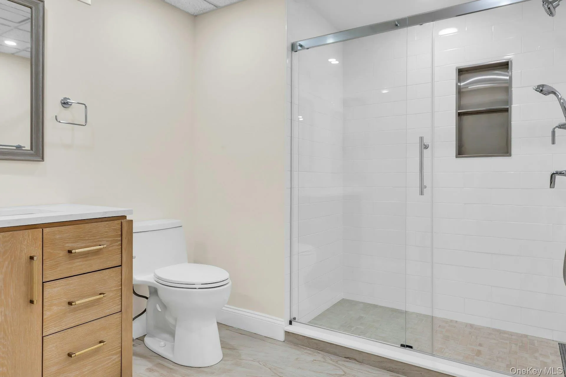 Lower-level Bathroom with full shower, vanity Lower-level Bathroom with full shower, vanity