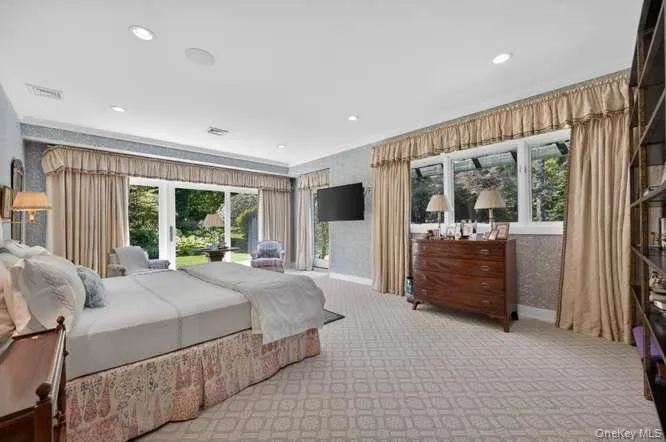 Glorious primary bedroom suite with tranquil views of the gardens. Glorious primary bedroom suite with tranquil views of the gardens.