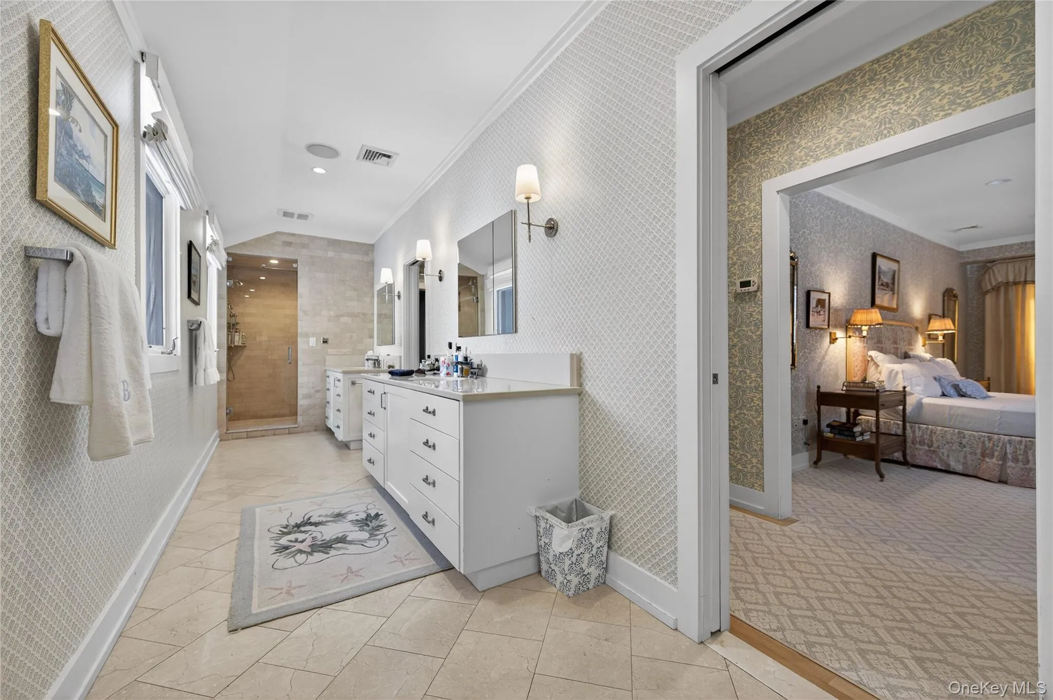 Primary bath with separate tub and shower. Double sinks and pocket doors. Radiant heated floors. Primary bath with separate tub and shower. Double sinks and pocket doors. Radiant heated floors.