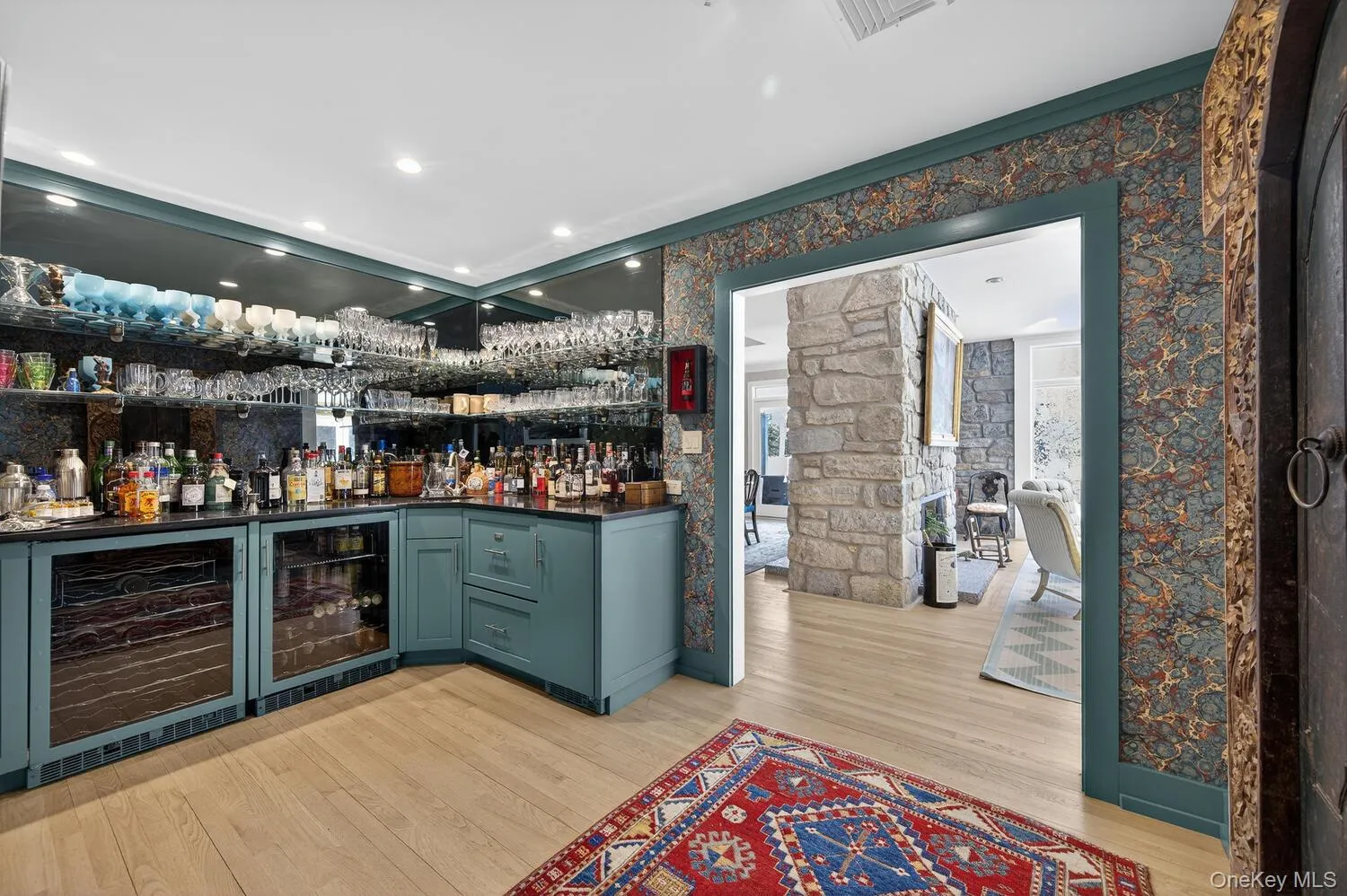 Conveniently located bar with wine fridge, dishwasher and ice machine. Conveniently located bar with wine fridge, dishwasher and ice machine.