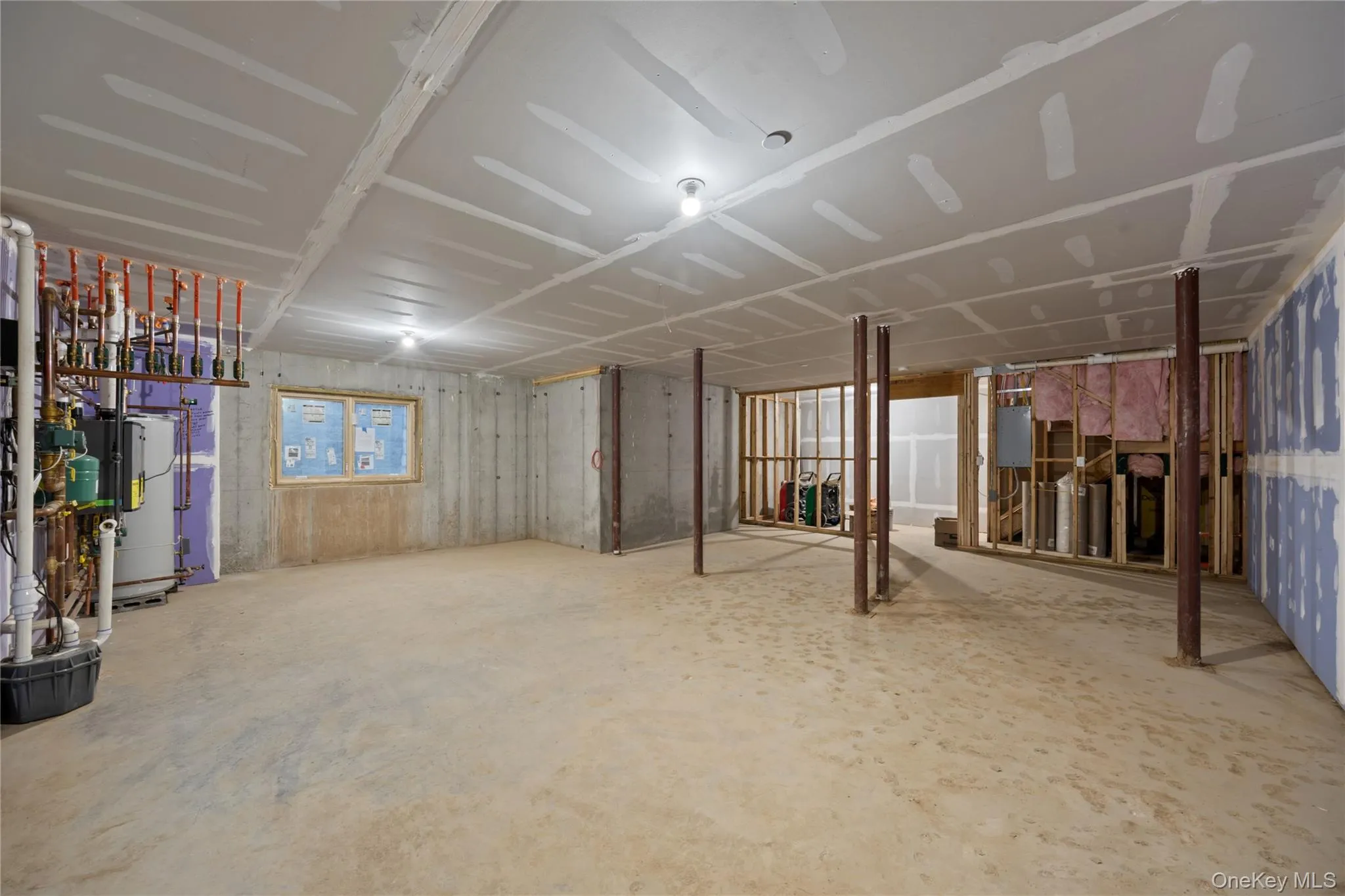 Full unfinished basement featuring well windows Full unfinished basement featuring well windows