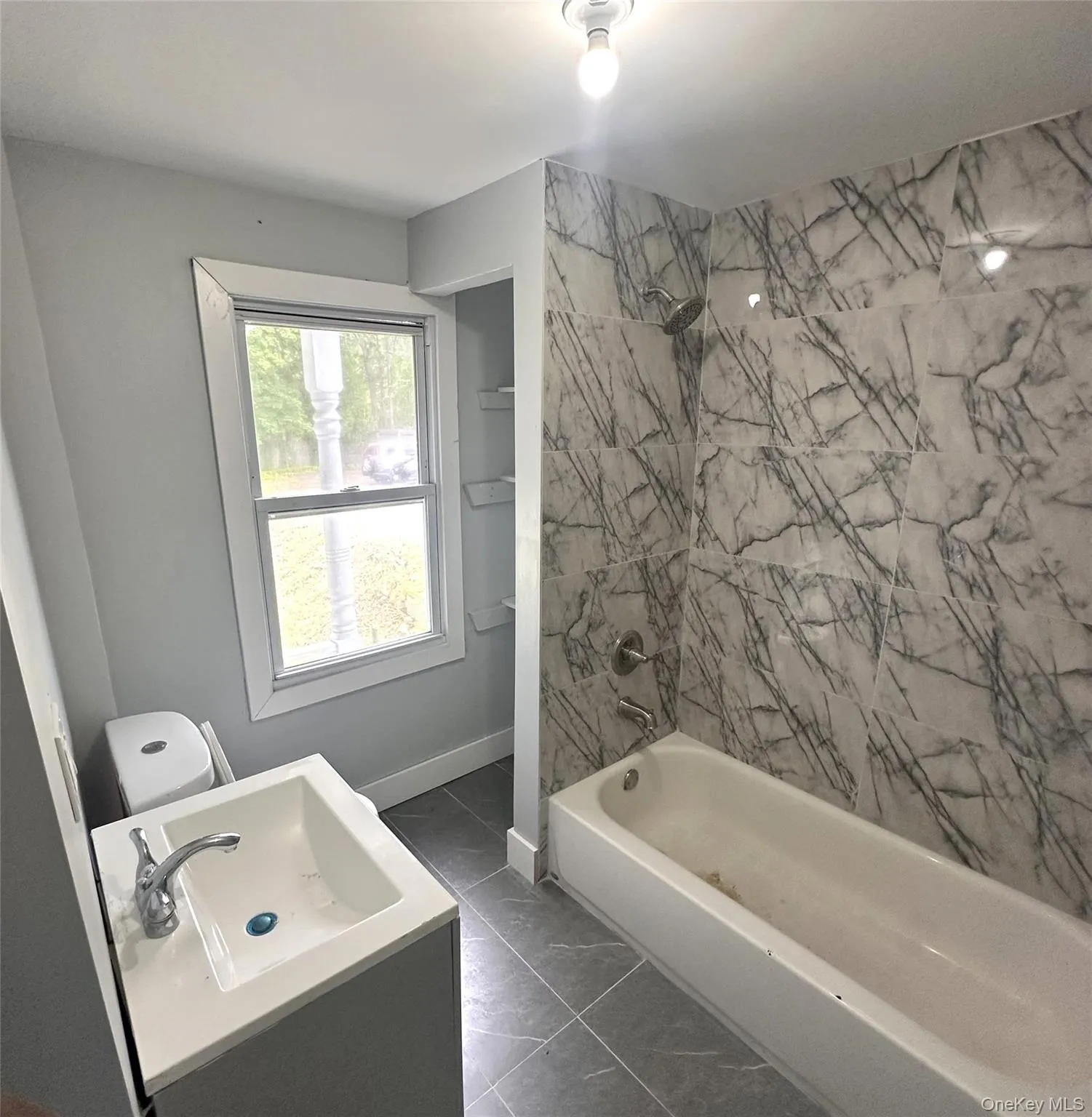 Full bathroom with artistic ceramic tile and ceramic floors, new vanity Full bathroom with artistic ceramic tile and ceramic floors, new vanity