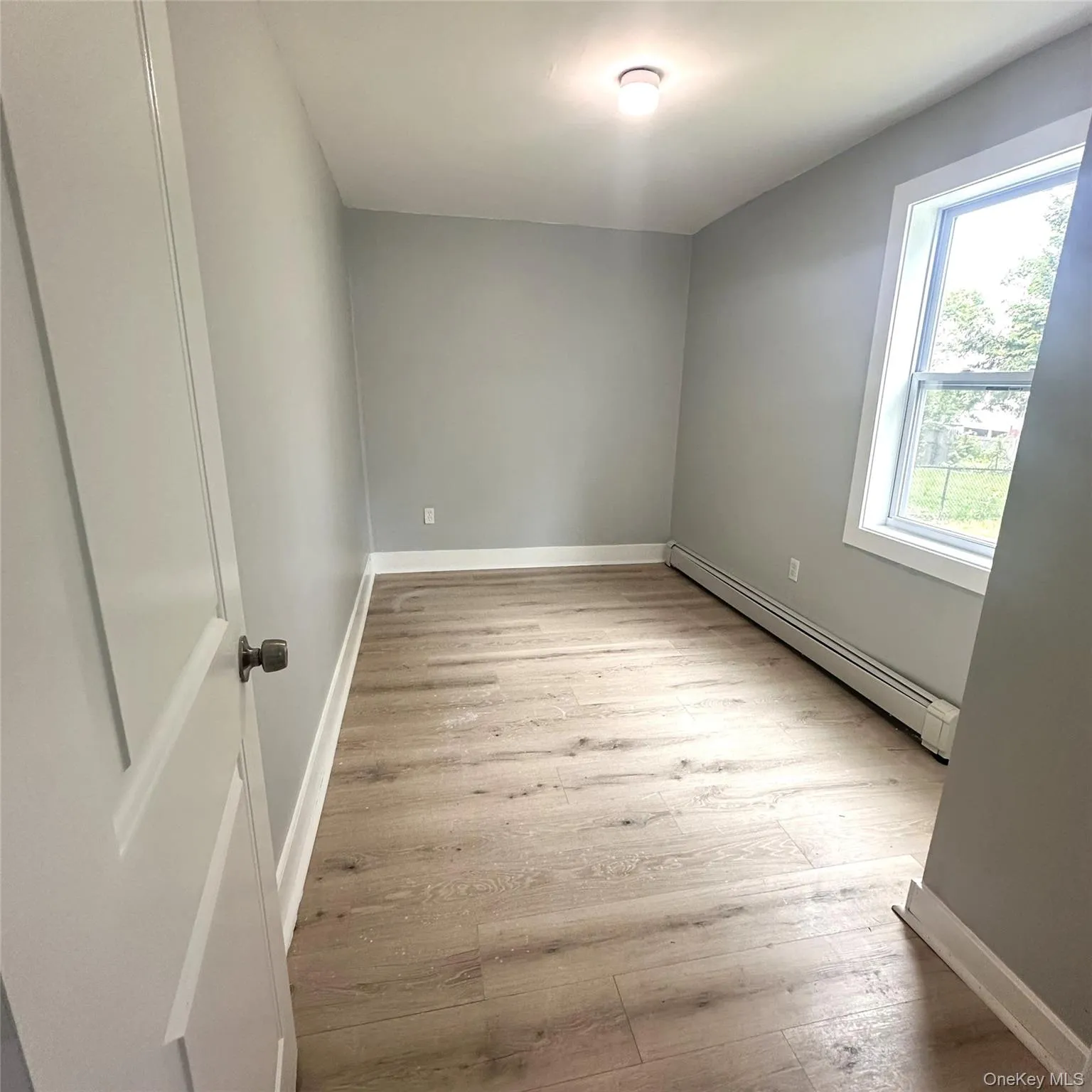 Third bedroom with vinyl flooring, freshly painted and baseboard heating. Third bedroom with vinyl flooring, freshly painted and baseboard heating.