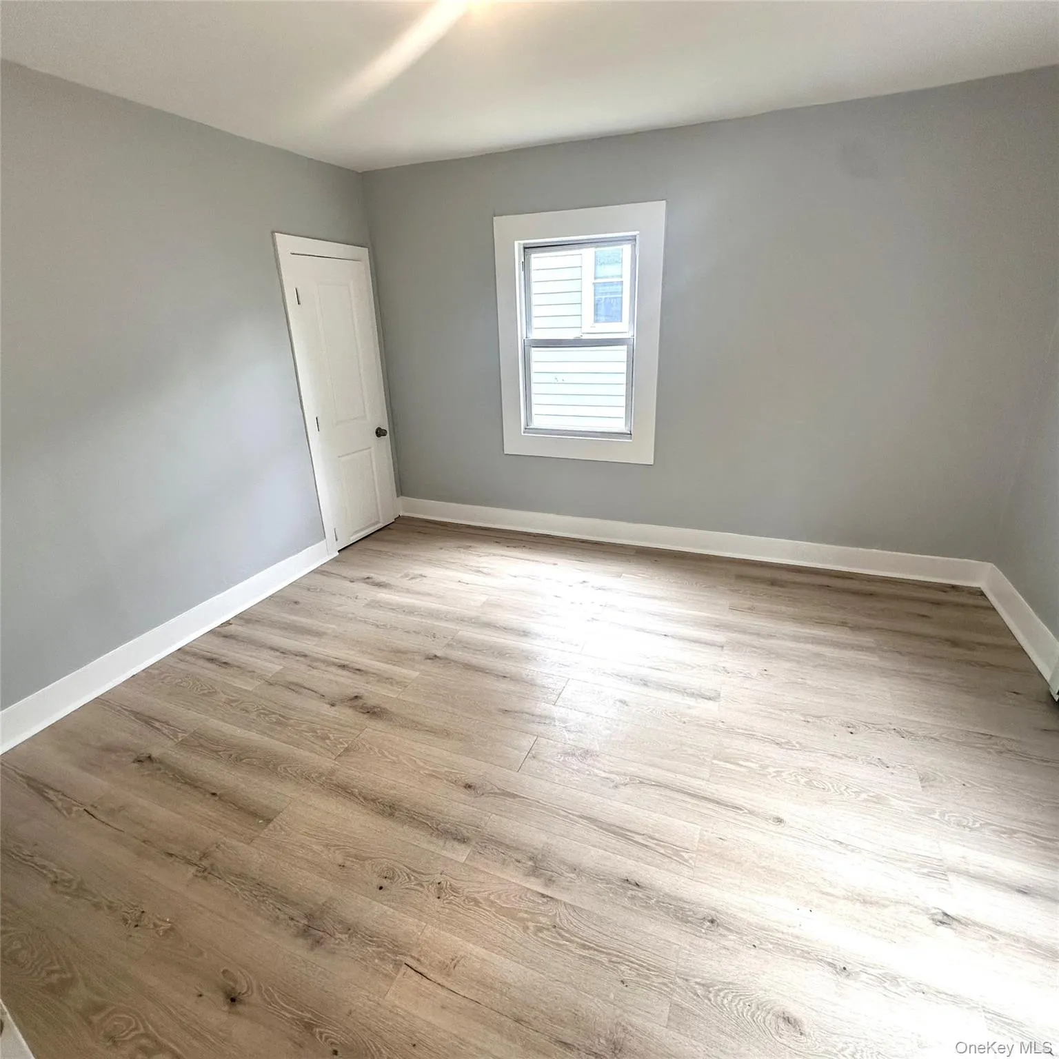 Second bedroom, vinyl flooring and baseboard heating. Second bedroom, vinyl flooring and baseboard heating.