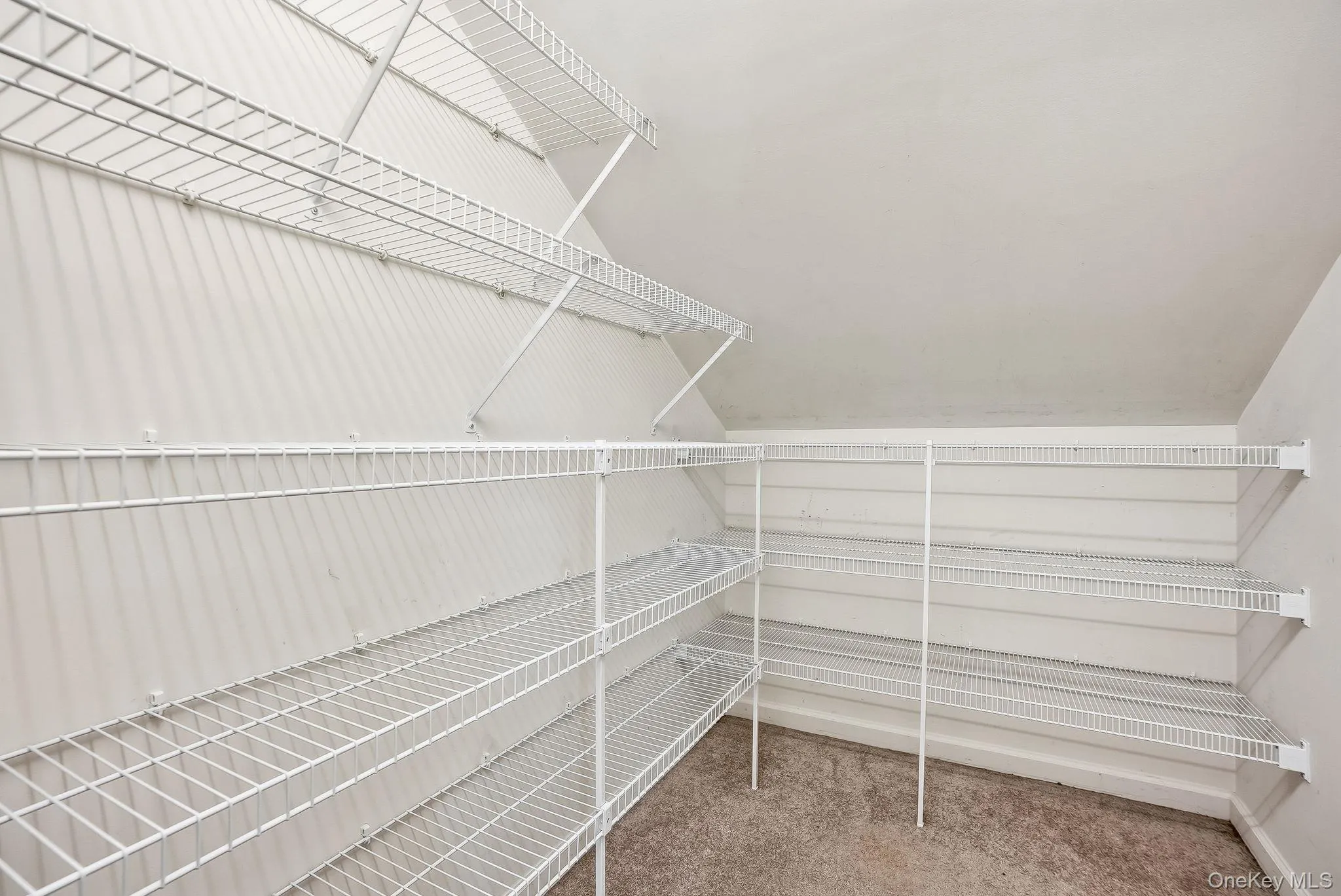 Primary bedroom walk-in with built-ins Primary bedroom walk-in with built-ins