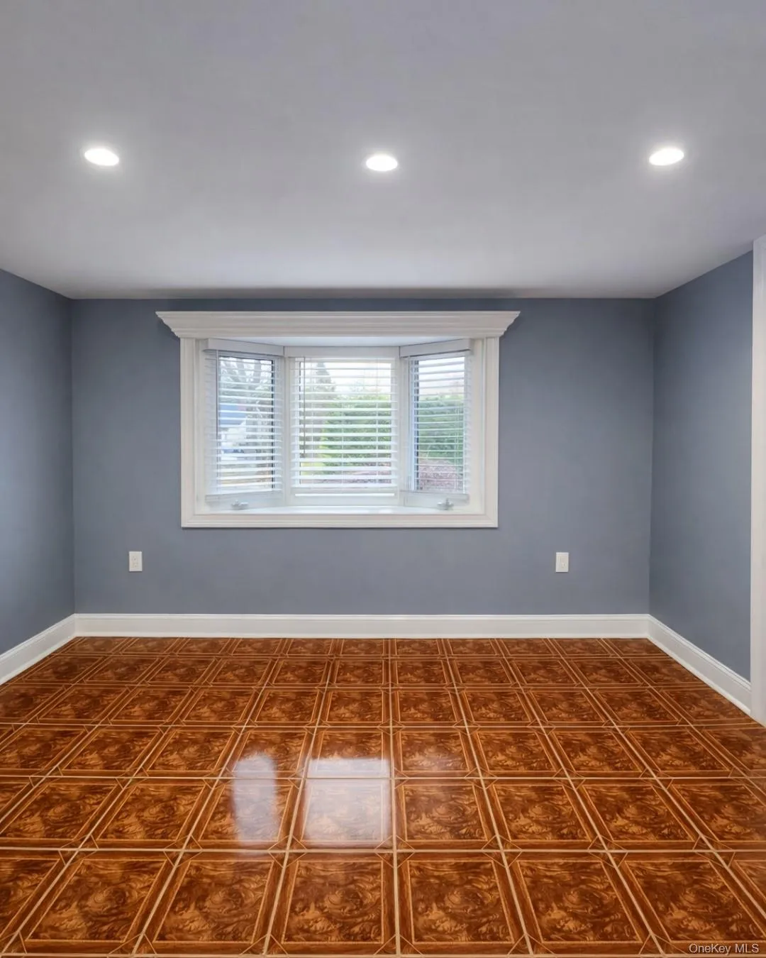 Unfurnished room featuring healthy amount of natural light and recessed lighting Unfurnished room featuring healthy amount of natural light and recessed lighting