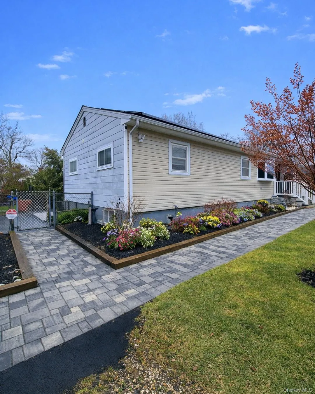 View of side of property featuring a gate View of side of property featuring a gate