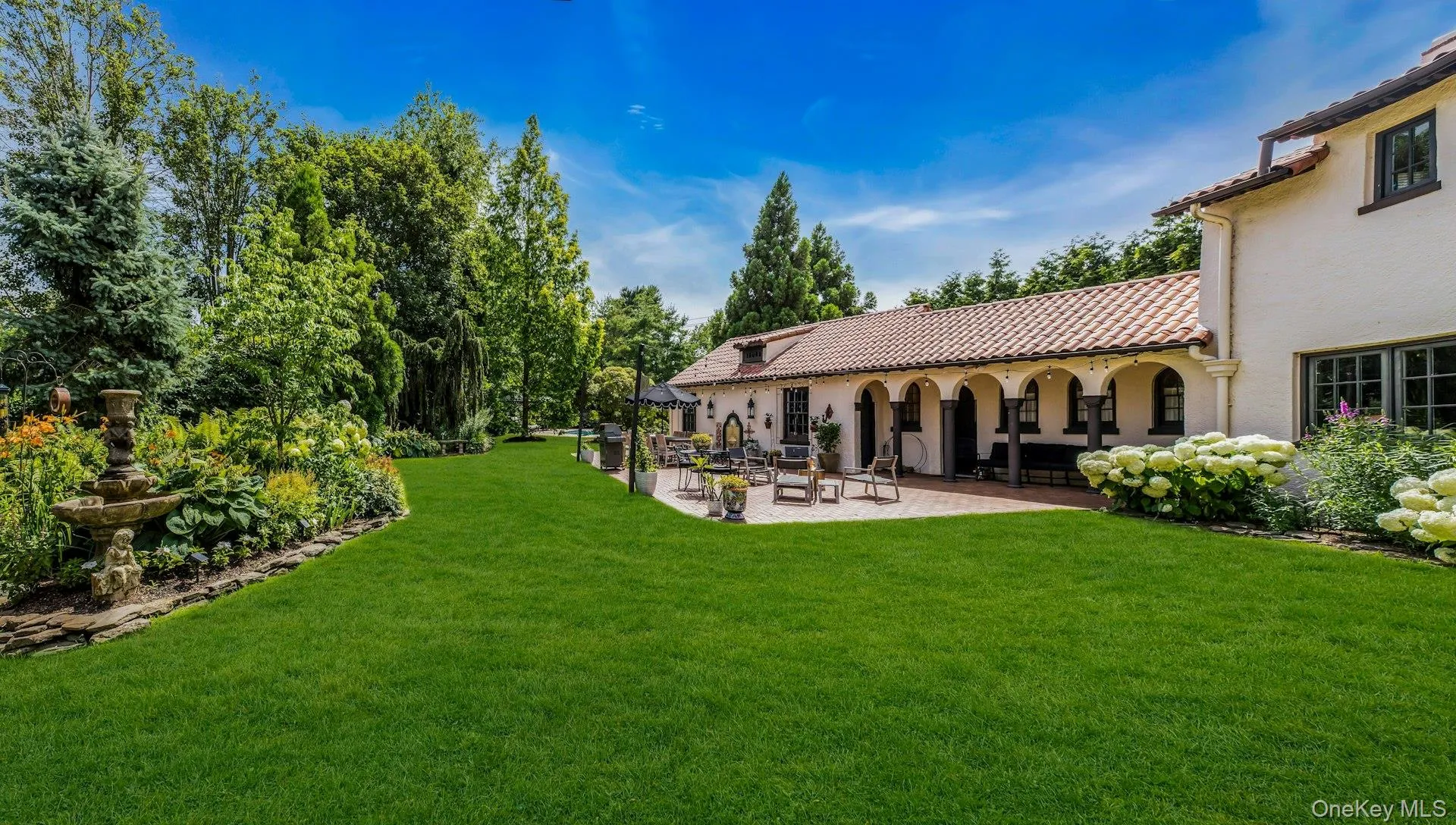 Private country club backyard featuring mature landscaping, fully fenced, brick patios, IGP & Spa, fountains Private country club backyard featuring mature landscaping, fully fenced, brick patios, IGP & Spa, fountains