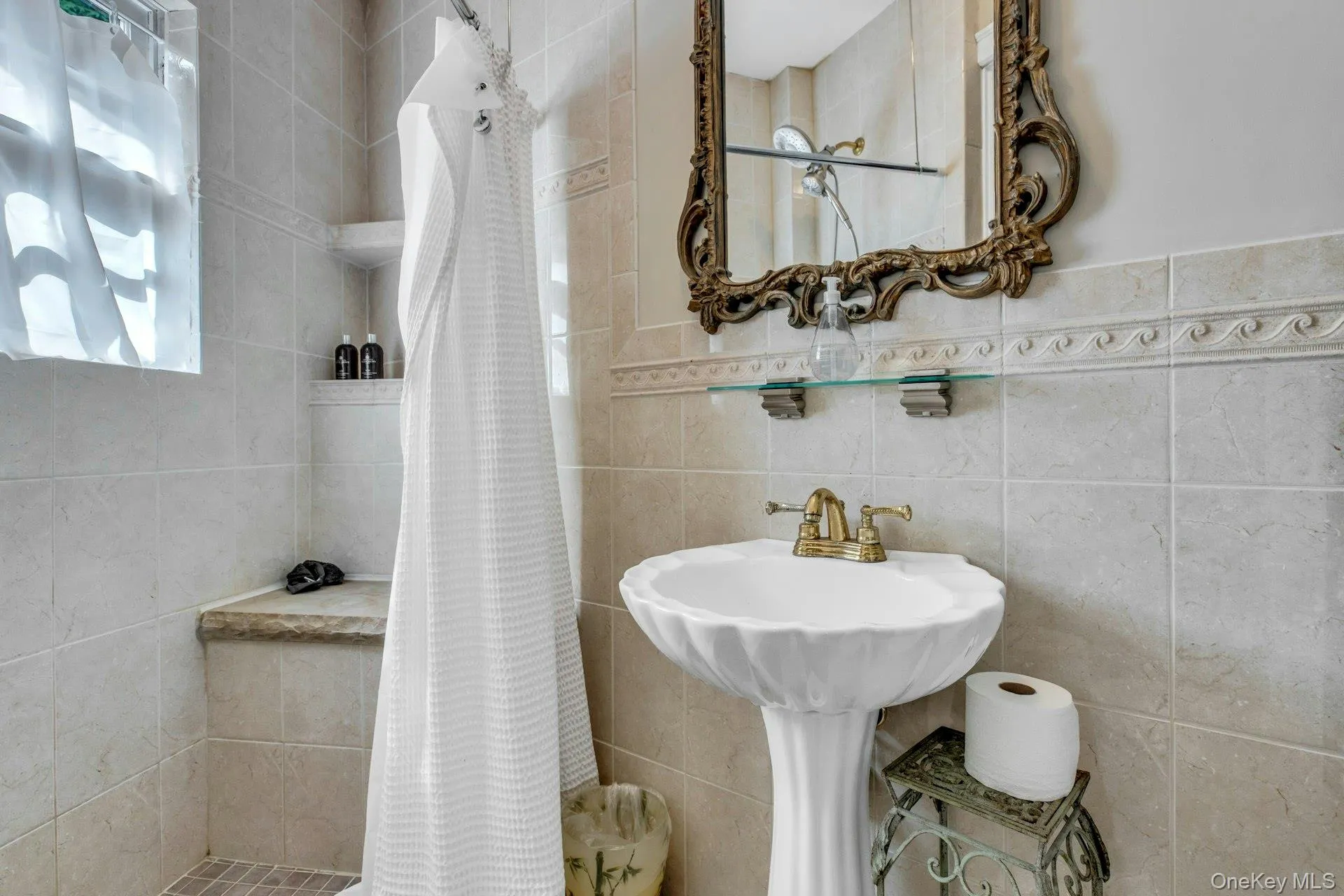 Guest cottage full bathroom featuring walk in shower, pedestal sink Guest cottage full bathroom featuring walk in shower, pedestal sink
