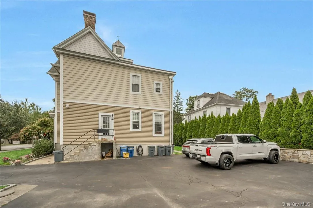 view of back of house and parking area view of back of house and parking area