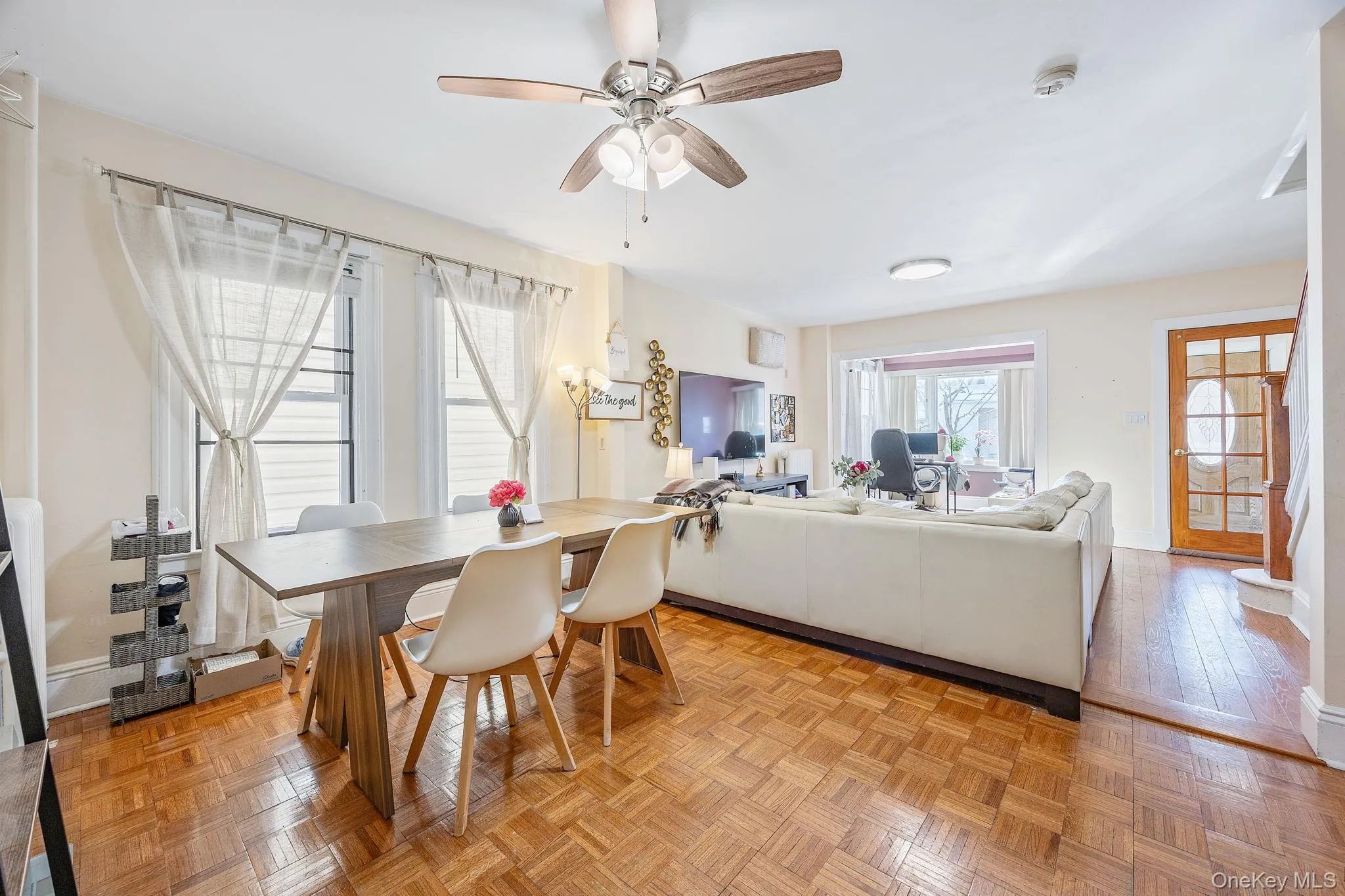 Dining room featuring parquet flooring and ceiling fan Dining room featuring parquet flooring and ceiling fan