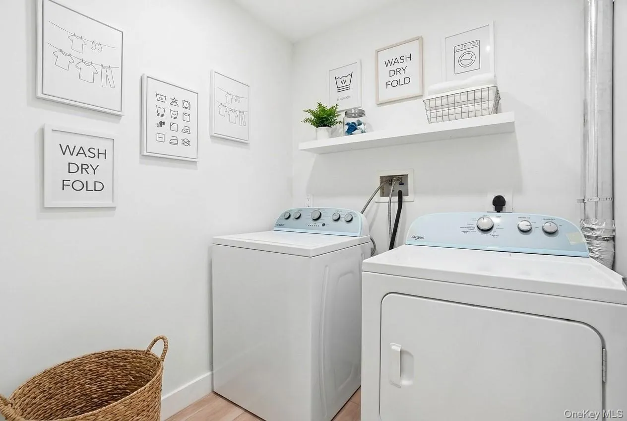 Lower-level laundry room offering convenient and functional space. Lower-level laundry room offering convenient and functional space.