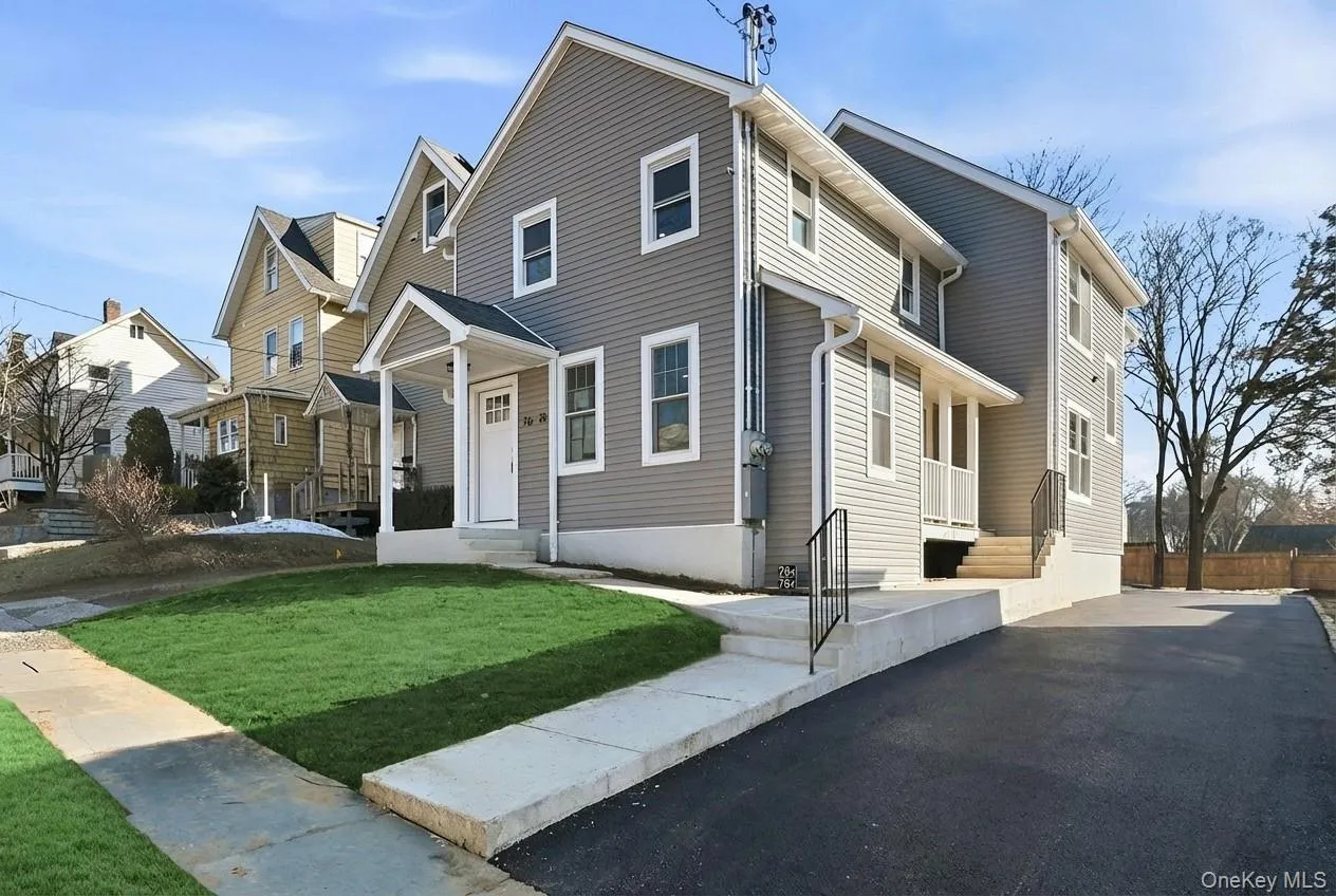 Beautiful curb appeal highlights the front of the home, featuring brand new vinyl siding and an inviting portico. Beautiful curb appeal highlights the front of the home, featuring brand new vinyl siding and an inviting portico.