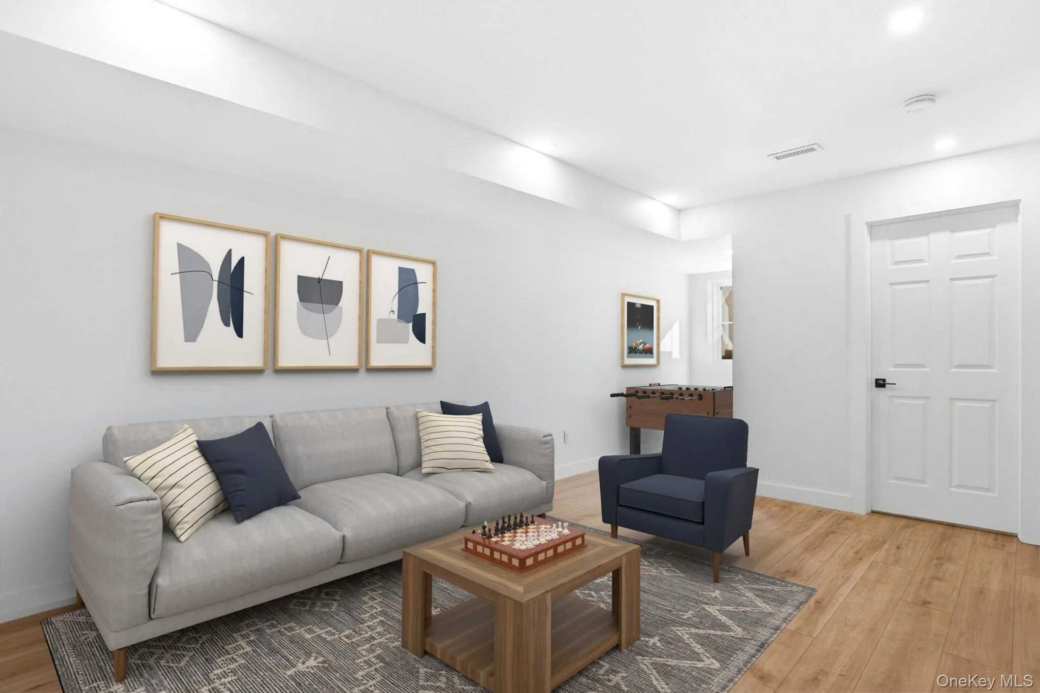 Virtually staged lower-level family room featuring luxury vinyl flooring, creating a stylish and functional space for family living Virtually staged lower-level family room featuring luxury vinyl flooring, creating a stylish and functional space for family living